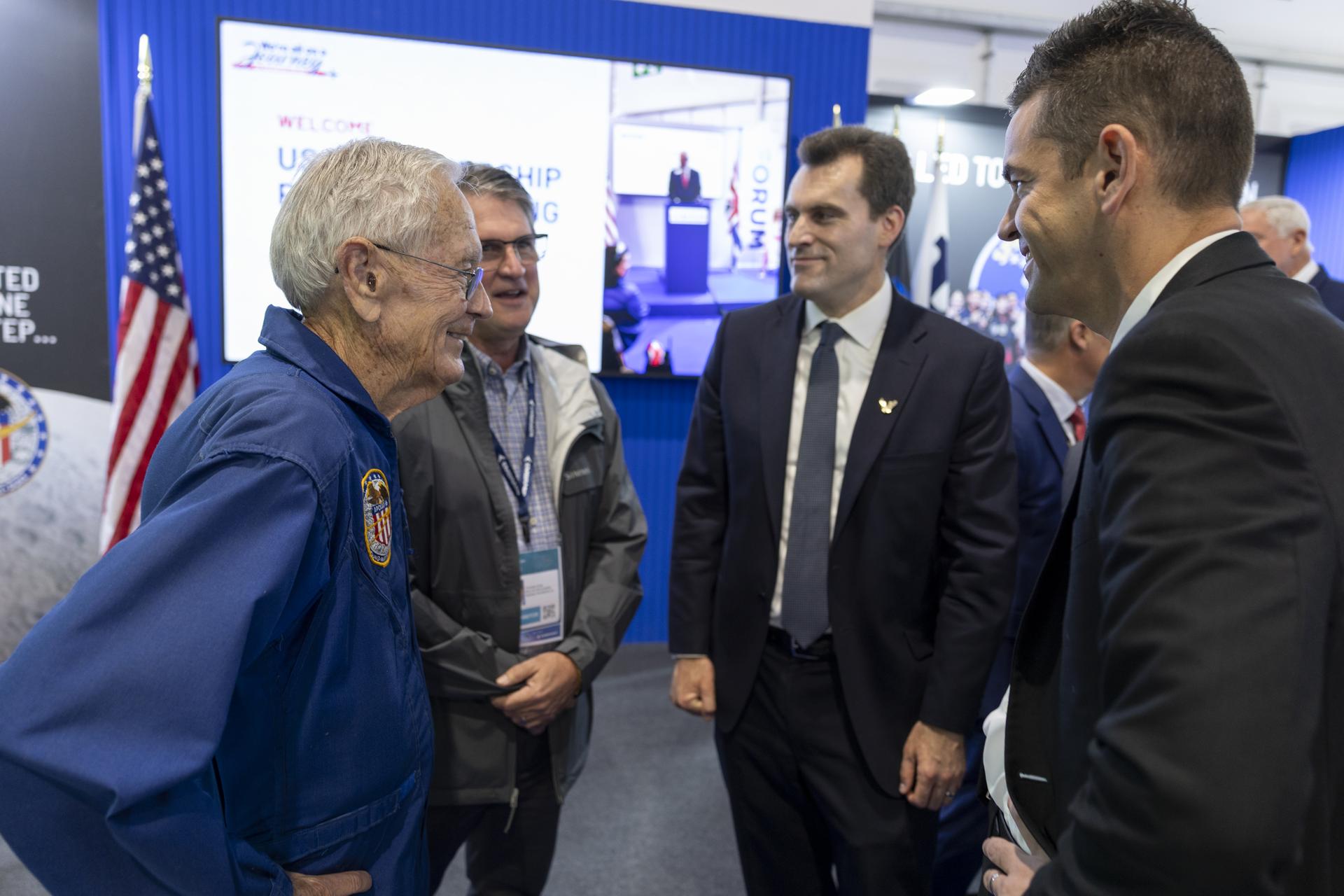 Jared Isaacman introduces Charlie Duke at the U.S. Pavillion at the Farnborough International Airshow in Farnborough, UK.