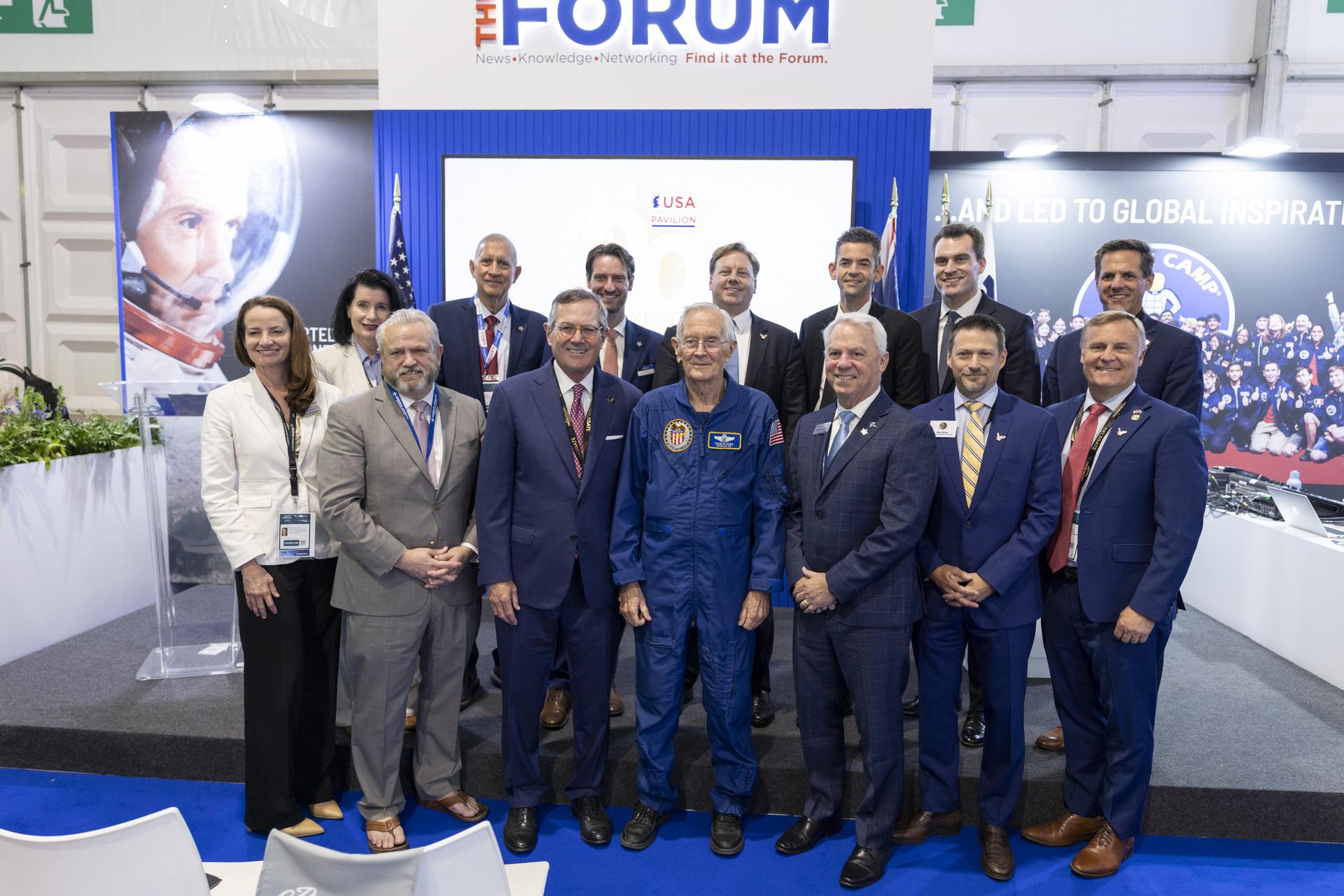 Jared Isaacman and Charlie Duke participate in the ribbon cutting for the U.S. Pavillion at Farnborough International Airshow in Farnborough, UK.