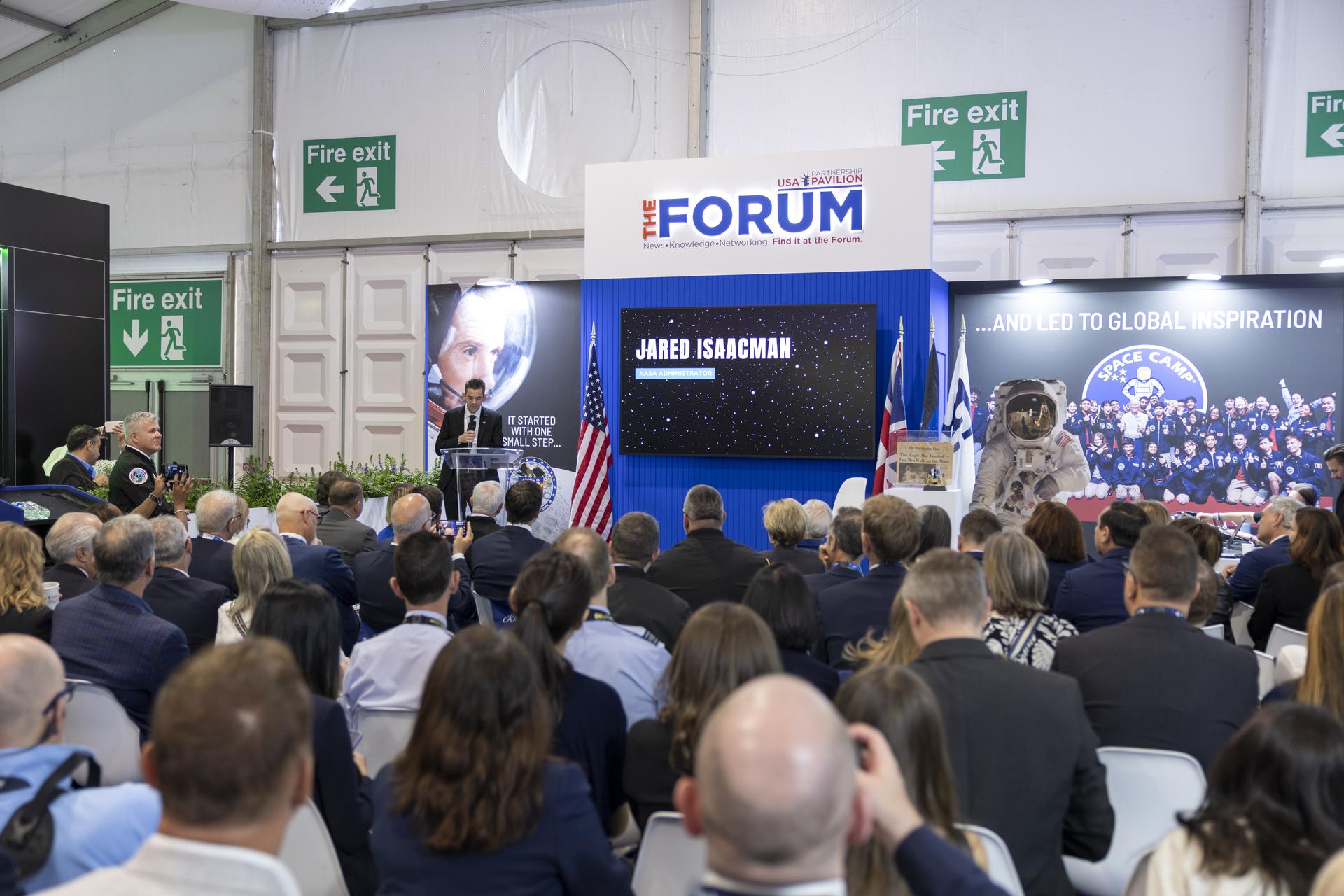 Jared Isaacman introduces Charlie Duke at the U.S. Pavillion at the Farnborough International Airshow in Farnborough, UK.