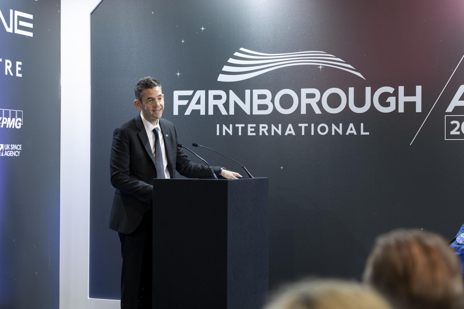 Jared Isaacman speaks at a booth at the Farnborough International Airshow in Farnborough, UK.