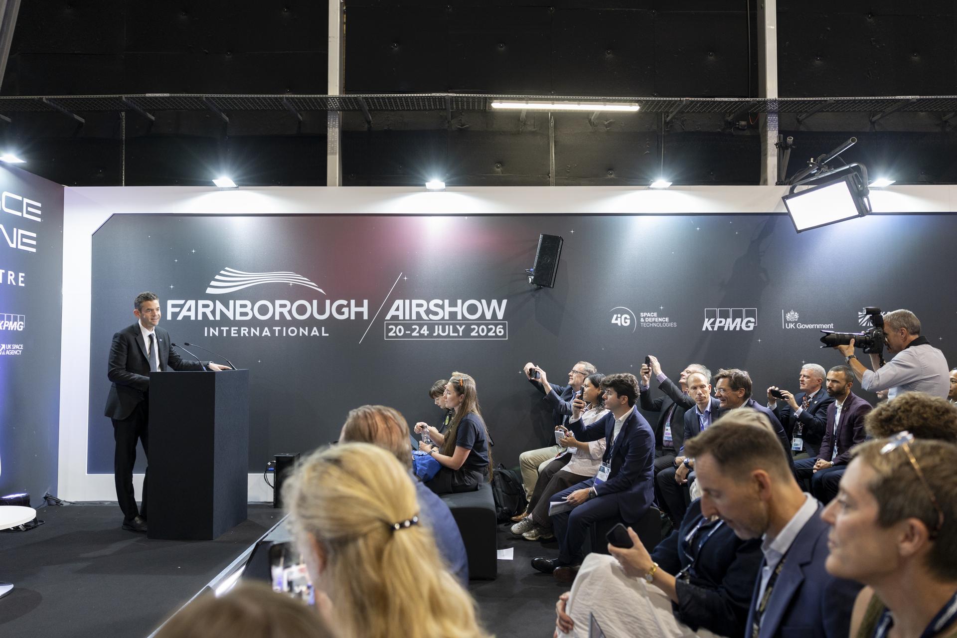 Jared Isaacman speaks at a booth at the Farnborough International Airshow in Farnborough, UK.