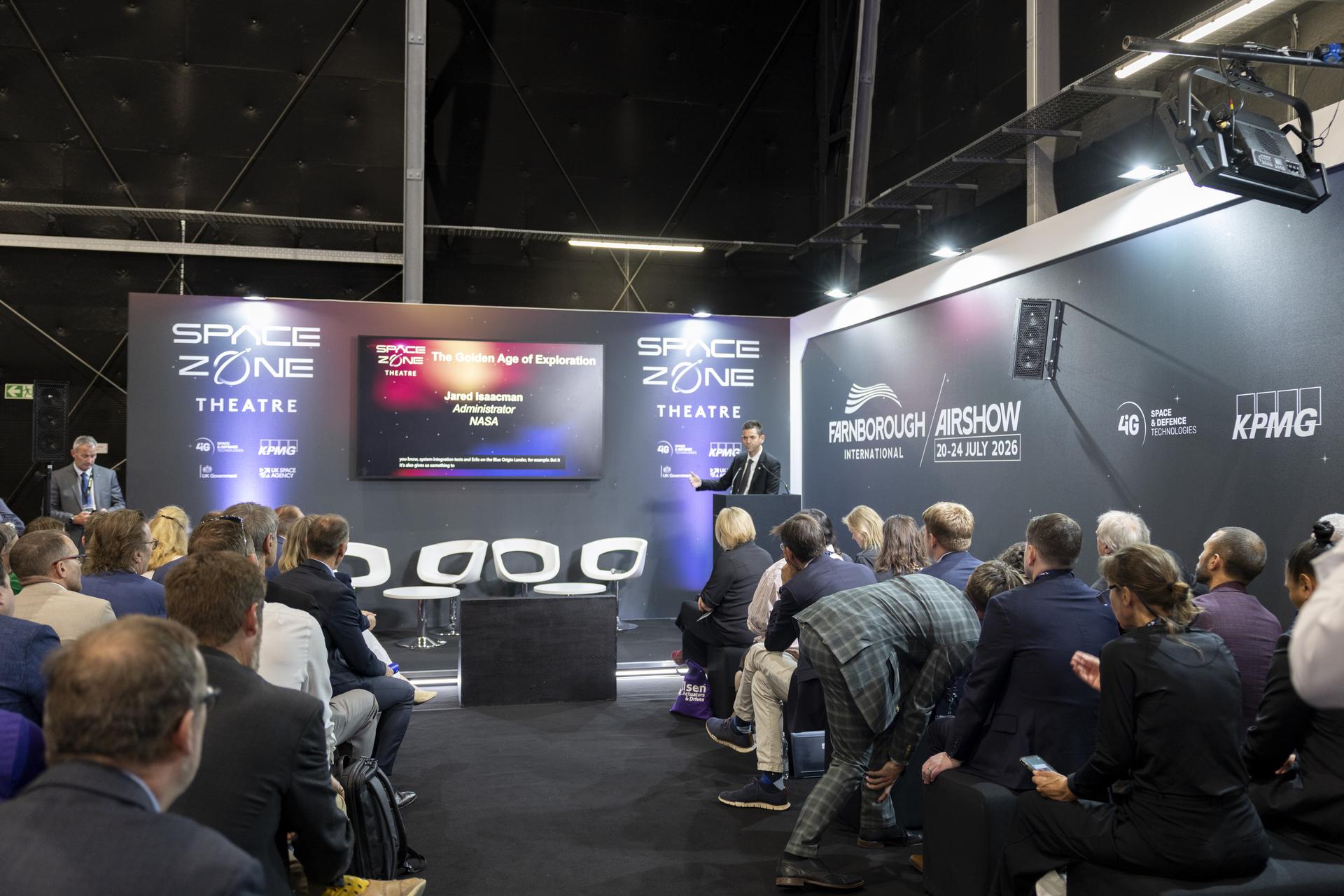 Jared Isaacman speaks at a booth at the Farnborough International Airshow in Farnborough, UK.