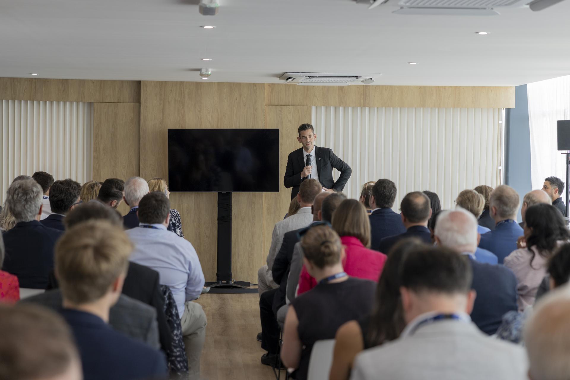 Jared Isaacman speaks at a booth at the Farnborough International Airshow in Farnborough, UK.