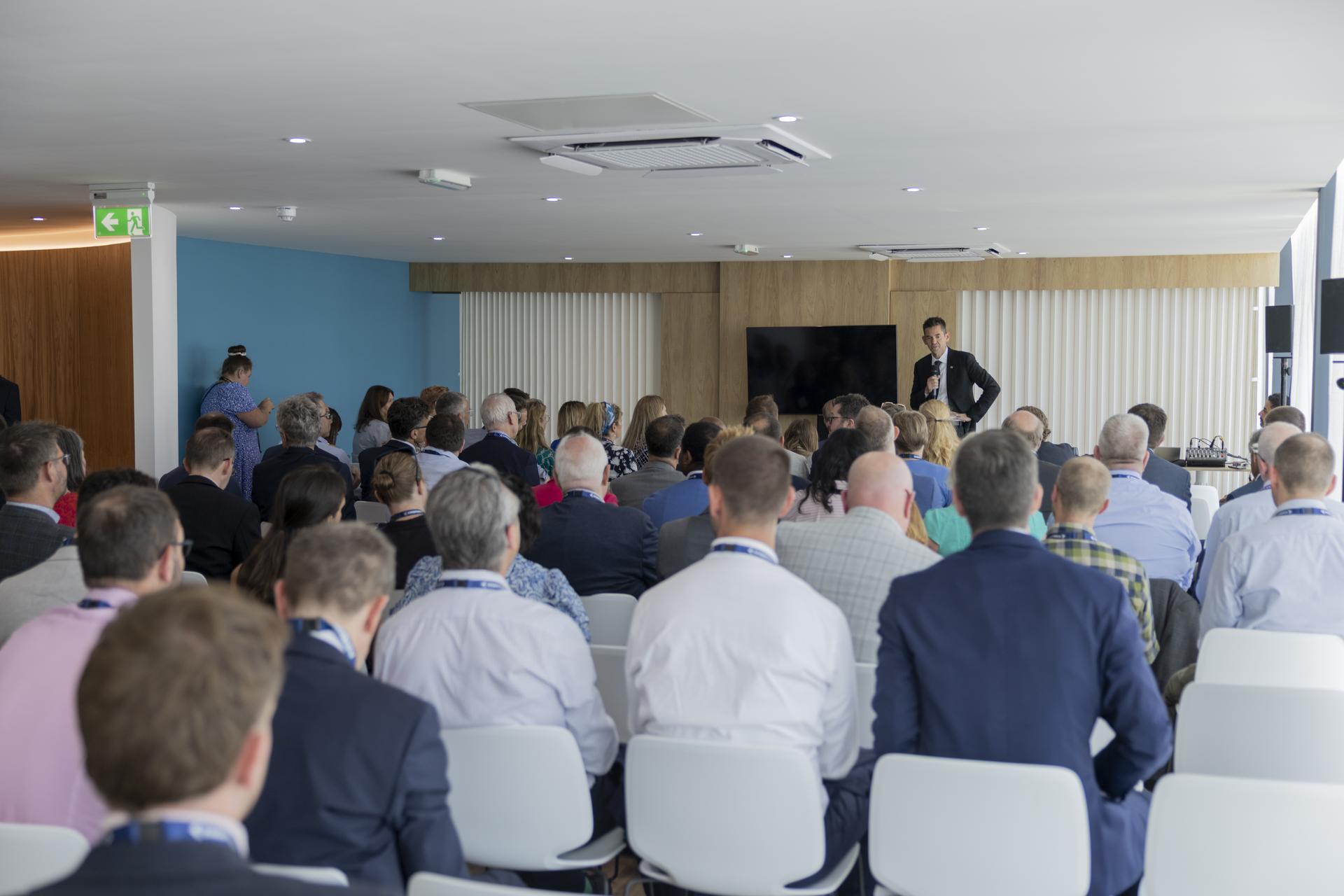 Jared Isaacman speaks at a booth at the Farnborough International Airshow in Farnborough, UK.
