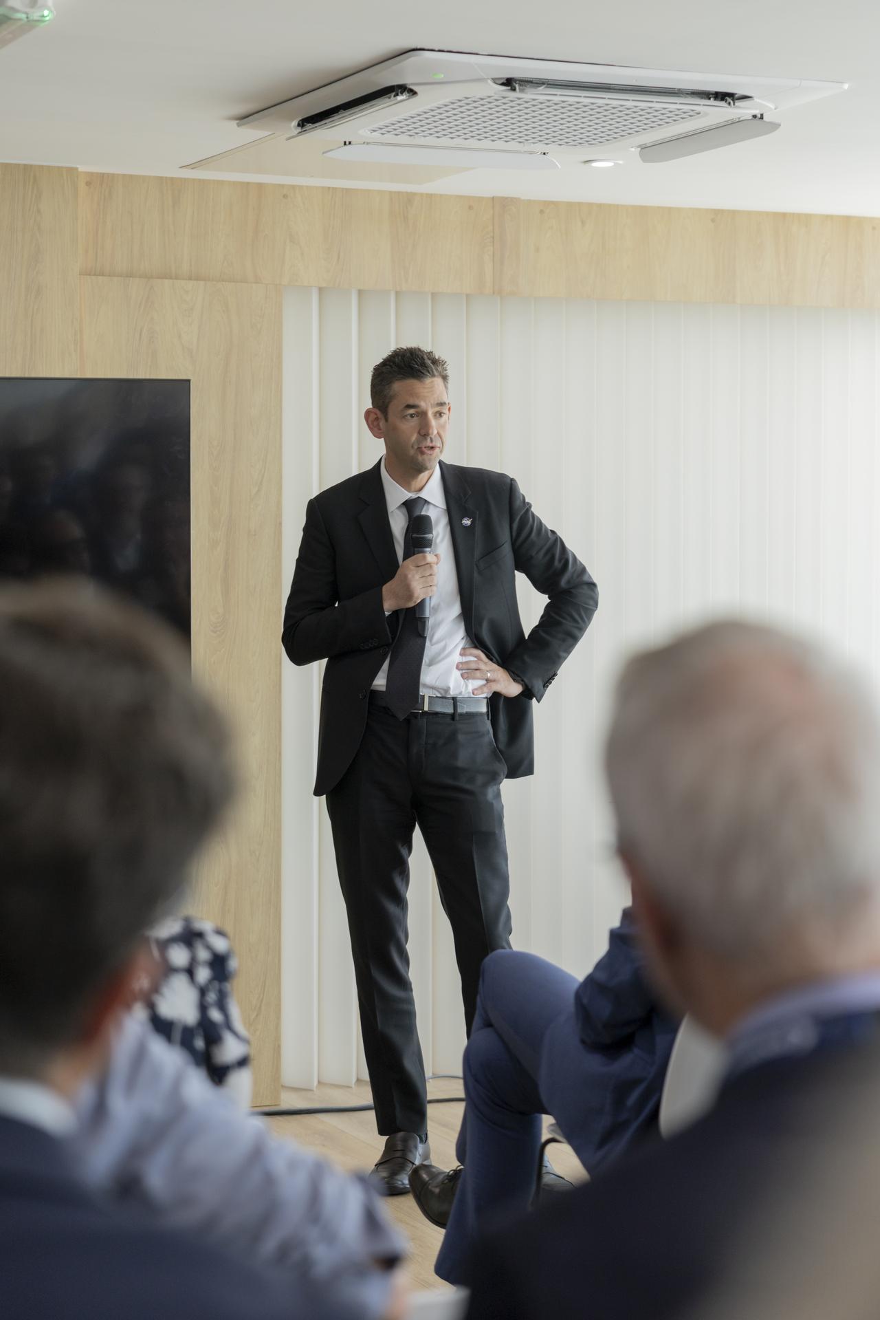 Jared Isaacman speaks at a booth at the Farnborough International Airshow in Farnborough, UK.