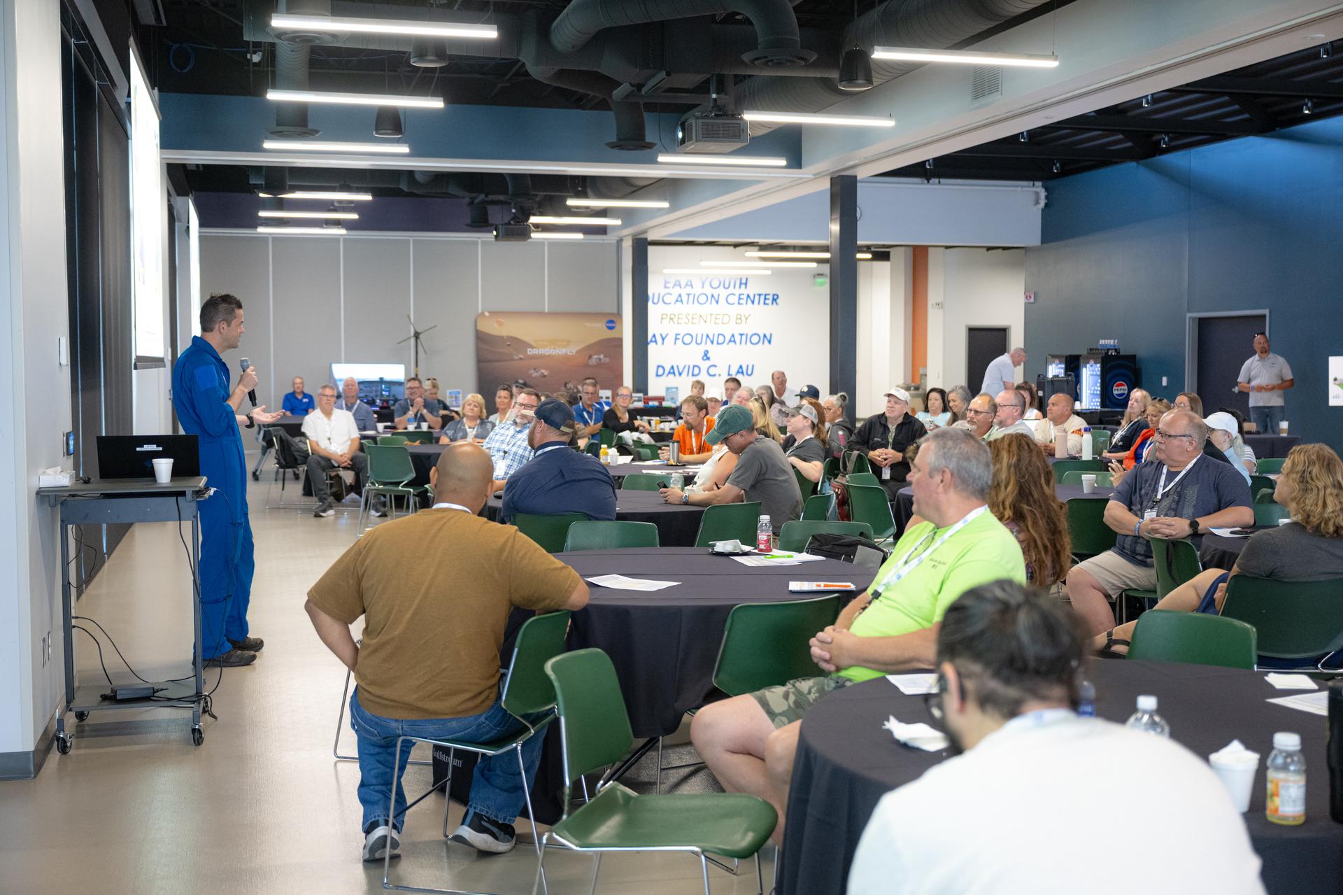 NASA Administrator Jared Isaacman speaks to K-12 educators during a "Teacher Day" event, Friday, July 24, 2026, at EAA AirVenture Oshkosh at Wittman Regional Airport in Oshkosh, Wis. Photo Credit: (NASA/John Kraus)