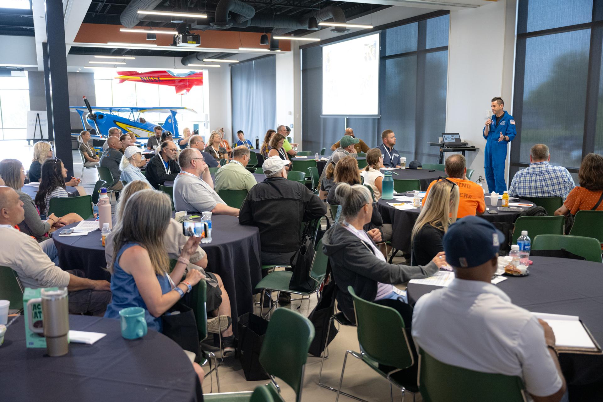 NASA Administrator Jared Isaacman speaks to K-12 educators during a "Teacher Day" event, Friday, July 24, 2026, at EAA AirVenture Oshkosh at Wittman Regional Airport in Oshkosh, Wis. Photo Credit: (NASA/John Kraus)