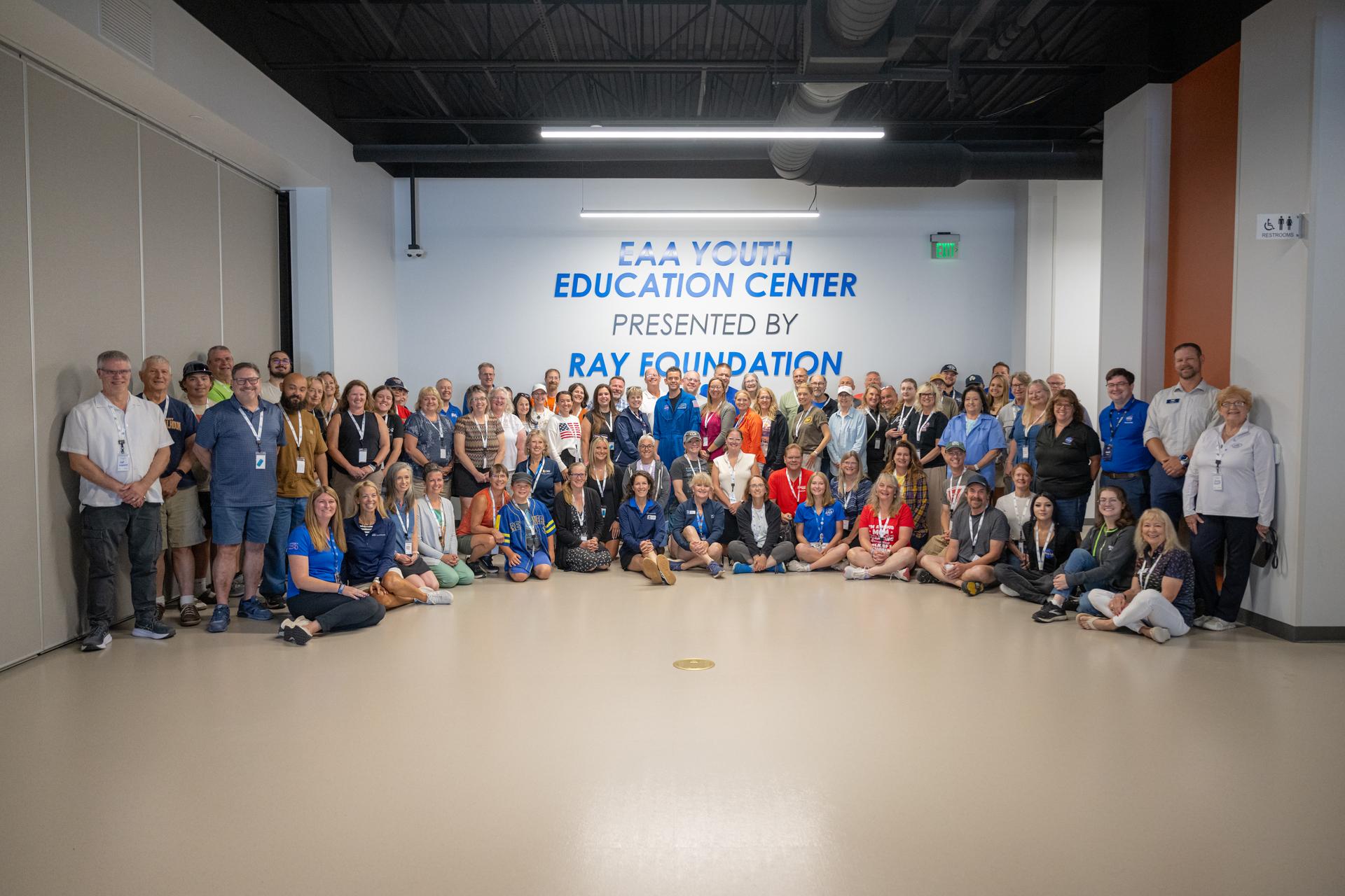 NASA Administrator Jared Isaacman poses for a photograph with K-12 educators during a "Teacher Day" event, Friday, July 24, 2026, at EAA AirVenture Oshkosh at Wittman Regional Airport in Oshkosh, Wis. Photo Credit: (NASA/John Kraus)