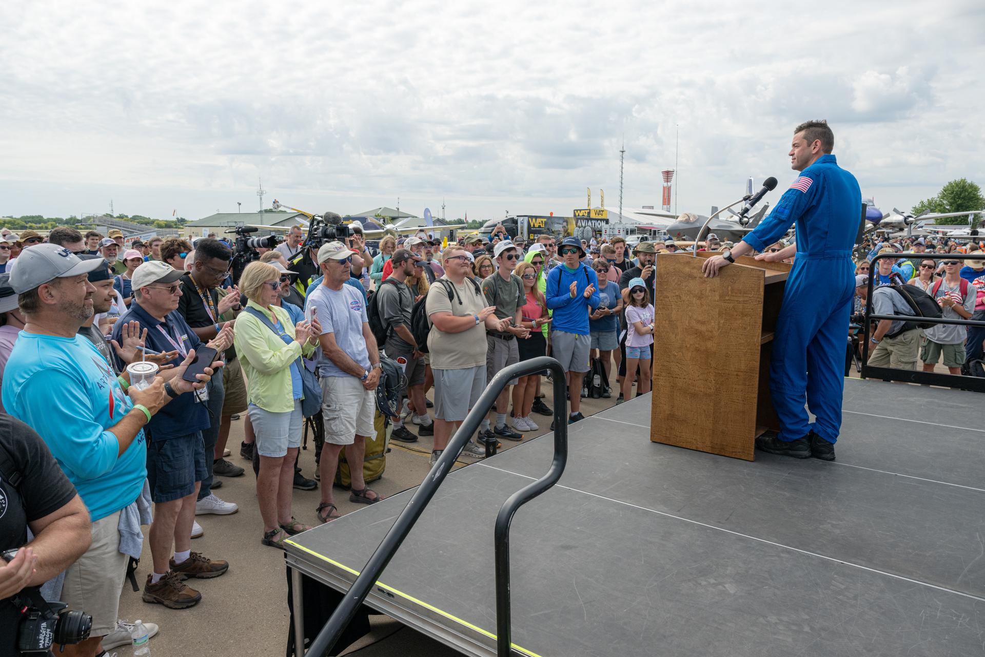 NASA Administrator Jared Isaacman speaks to a crowd of air show attendees, Friday, July 24, 2026, at EAA AirVenture Oshkosh at Wittman Regional Airport in Oshkosh, Wis. Photo Credit: (NASA/John Kraus)