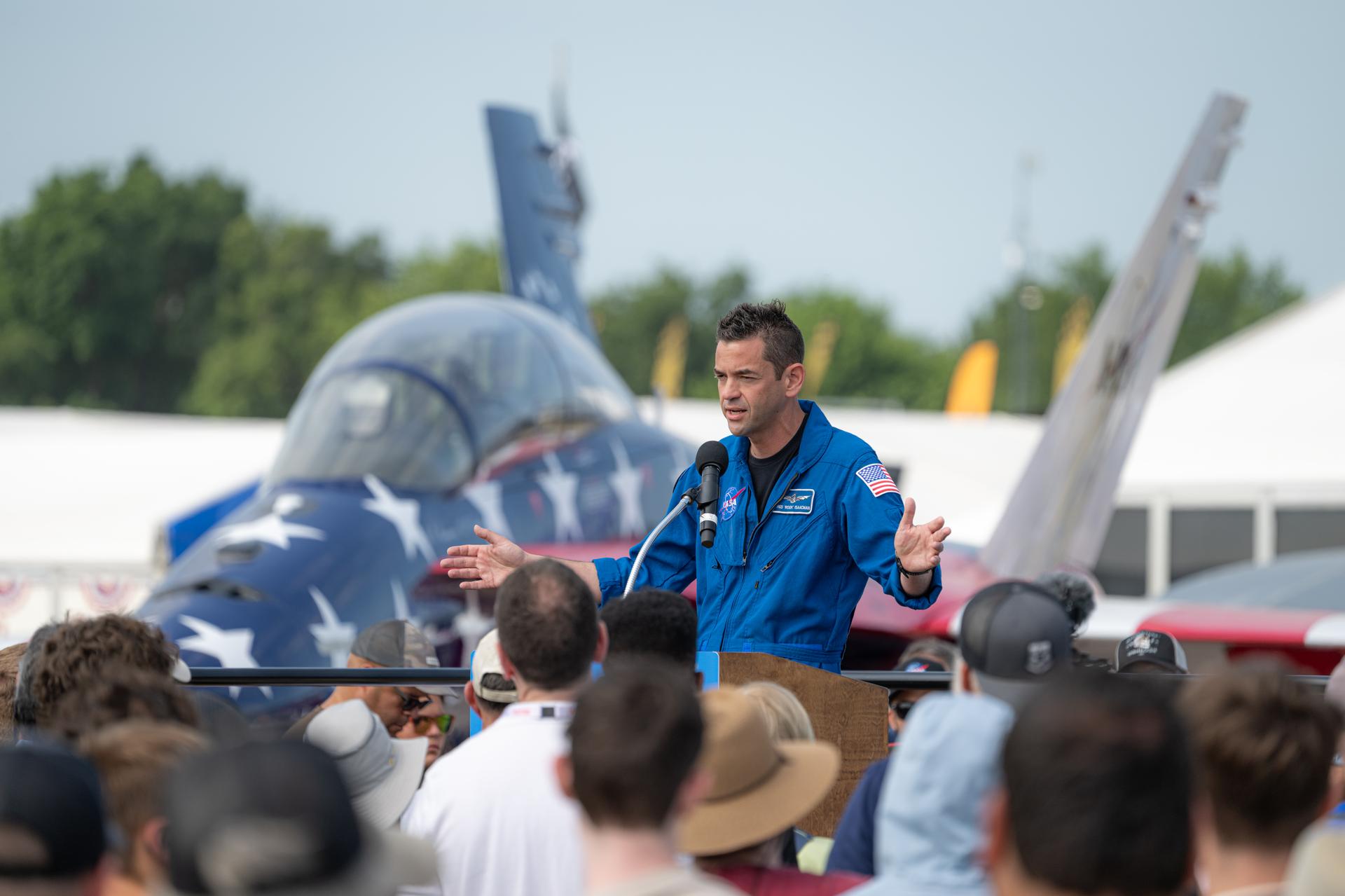 NASA Administrator Jared Isaacman speaks to a crowd of air show attendees, Friday, July 24, 2026, at EAA AirVenture Oshkosh at Wittman Regional Airport in Oshkosh, Wis. Photo Credit: (NASA/John Kraus)
