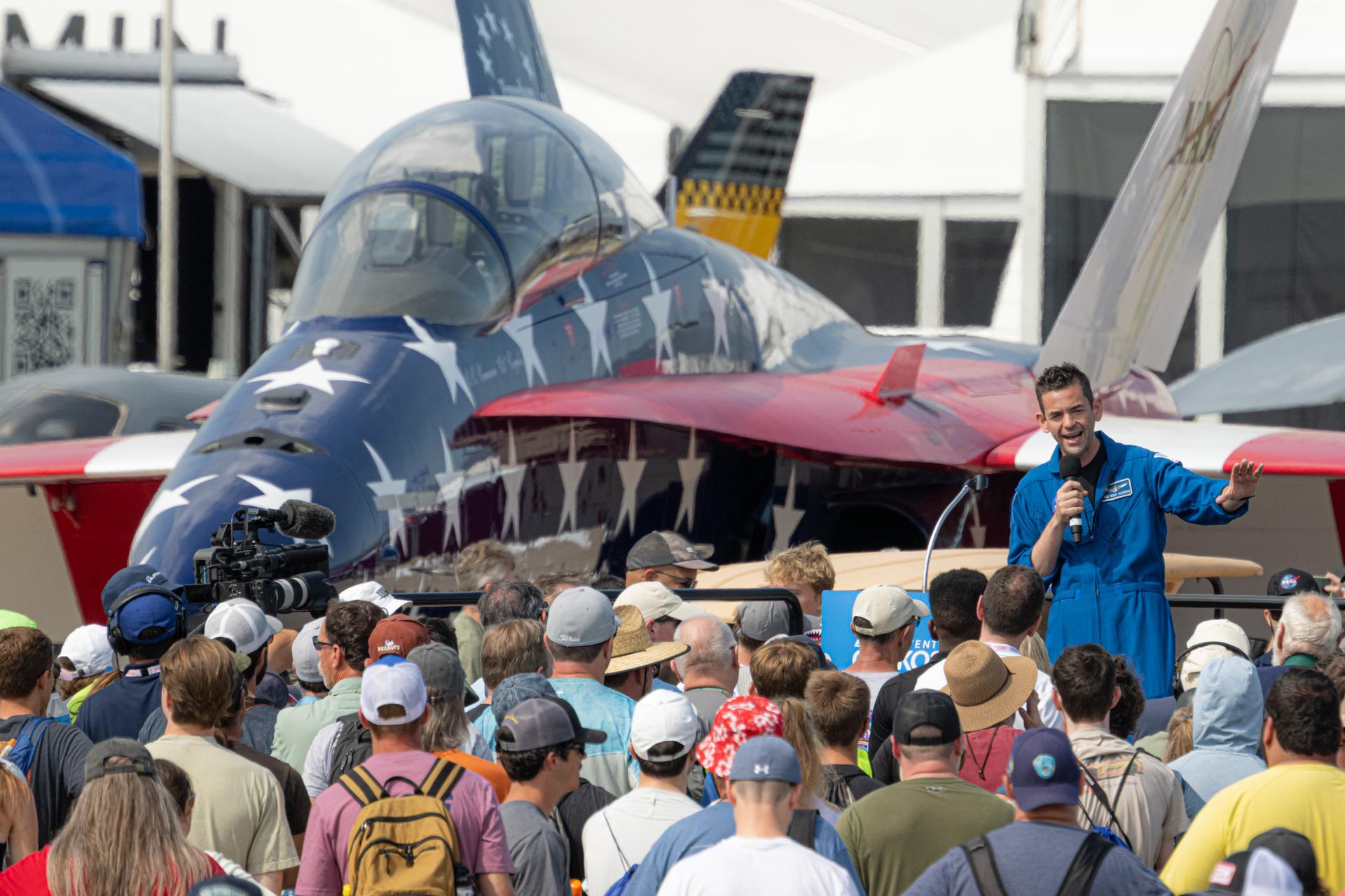 NASA Administrator Jared Isaacman speaks to a crowd of air show attendees, Friday, July 24, 2026, at EAA AirVenture Oshkosh at Wittman Regional Airport in Oshkosh, Wis. Photo Credit: (NASA/John Kraus)