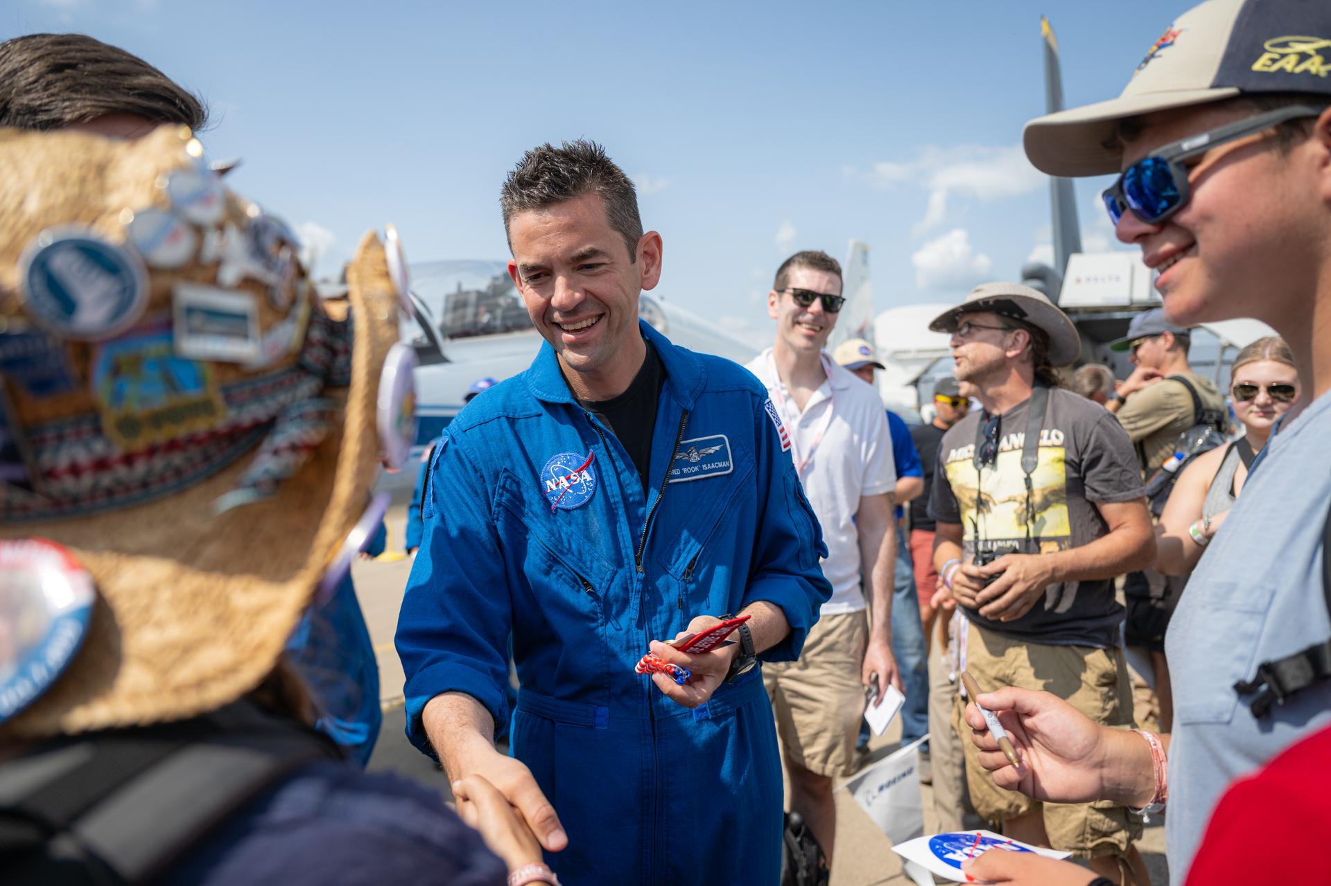 NASA Administrator Jared Isaacman greets air show attendees following a speaking arrangement, Friday, July 24, 2026, at EAA AirVenture Oshkosh at Wittman Regional Airport in Oshkosh, Wis. Photo Credit: (NASA/John Kraus)
