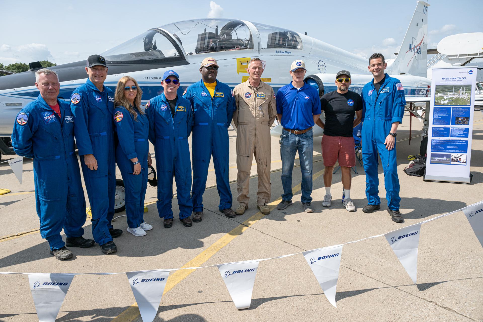 NASA Administrator Jared Isaacman poses for a photograph with members of the NASA workforce following a speaking arrangement, Friday, July 24, 2026, at EAA AirVenture Oshkosh at Wittman Regional Airport in Oshkosh, Wis. Photo Credit: (NASA/John Kraus)