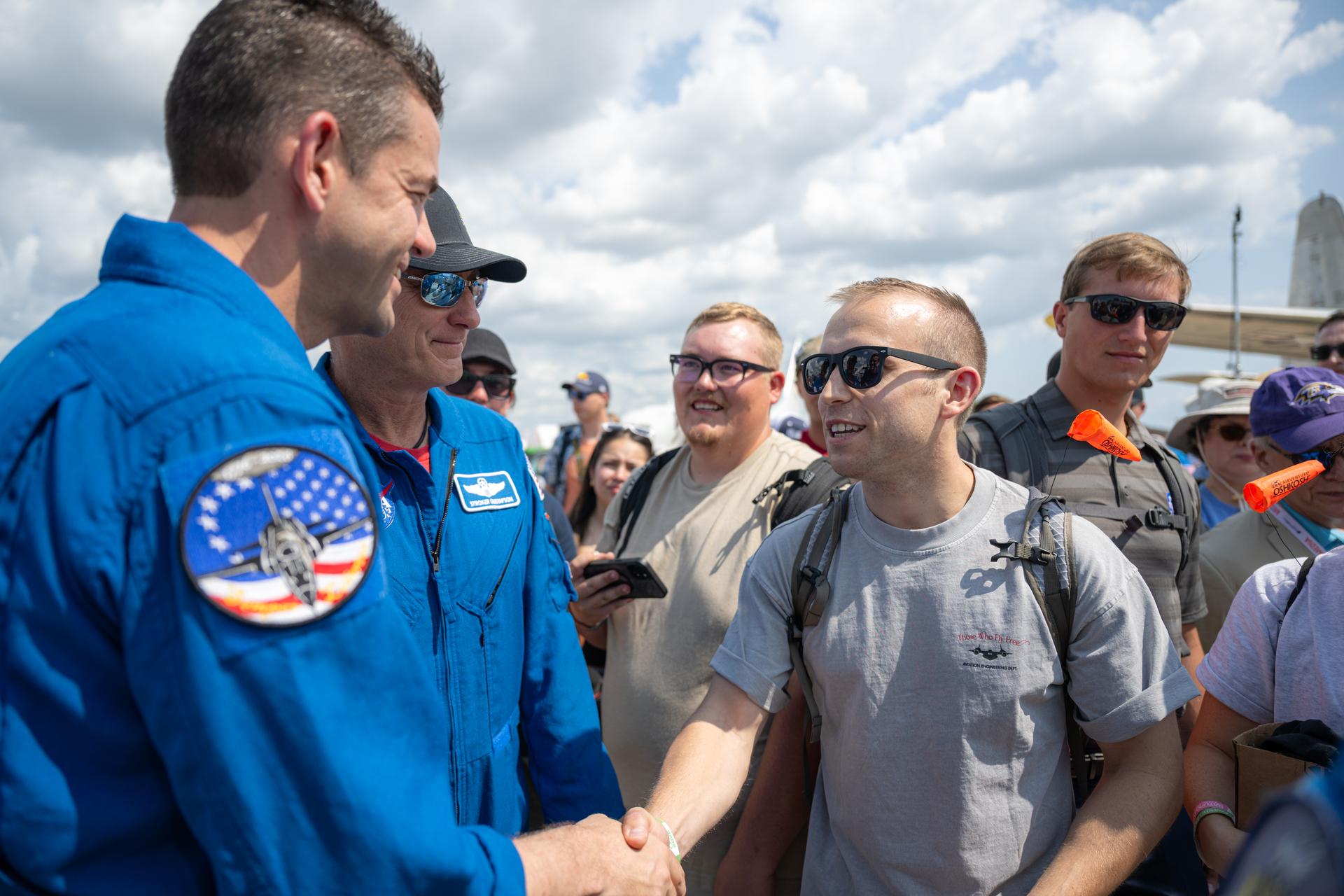 NASA Administrator Jared Isaacman greets air show attendees following a speaking arrangement, Friday, July 24, 2026, at EAA AirVenture Oshkosh at Wittman Regional Airport in Oshkosh, Wis. Photo Credit: (NASA/John Kraus)