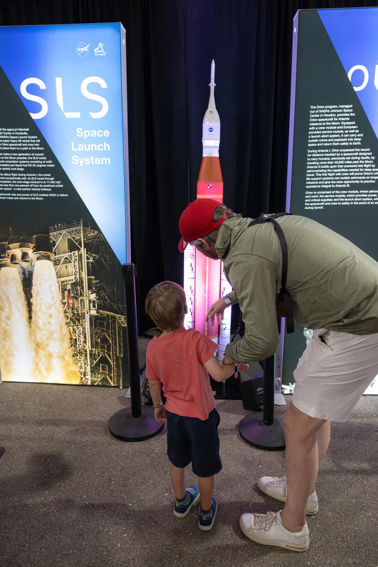 Air show attendees visit NASA's exhibit at EAA AirVenture Oshkosh, Friday, July 24, 2026, at Wittman Regional Airport in Oshkosh, Wis. Photo Credit: (NASA/John Kraus)