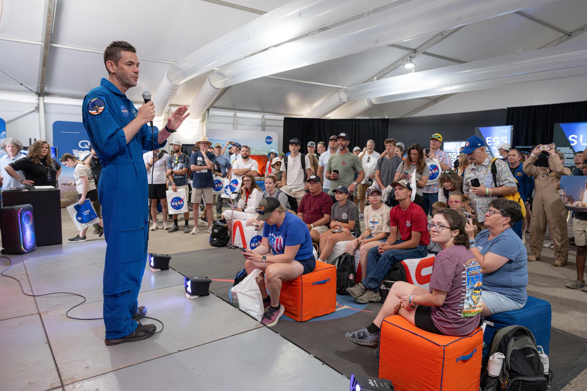 NASA Administrator Jared Isaacman speaks to air show attendees, Friday, July 24, 2026, at NASA's exhibit at EAA AirVenture Oshkosh at Wittman Regional Airport in Oshkosh, Wis. Photo Credit: (NASA/John Kraus)