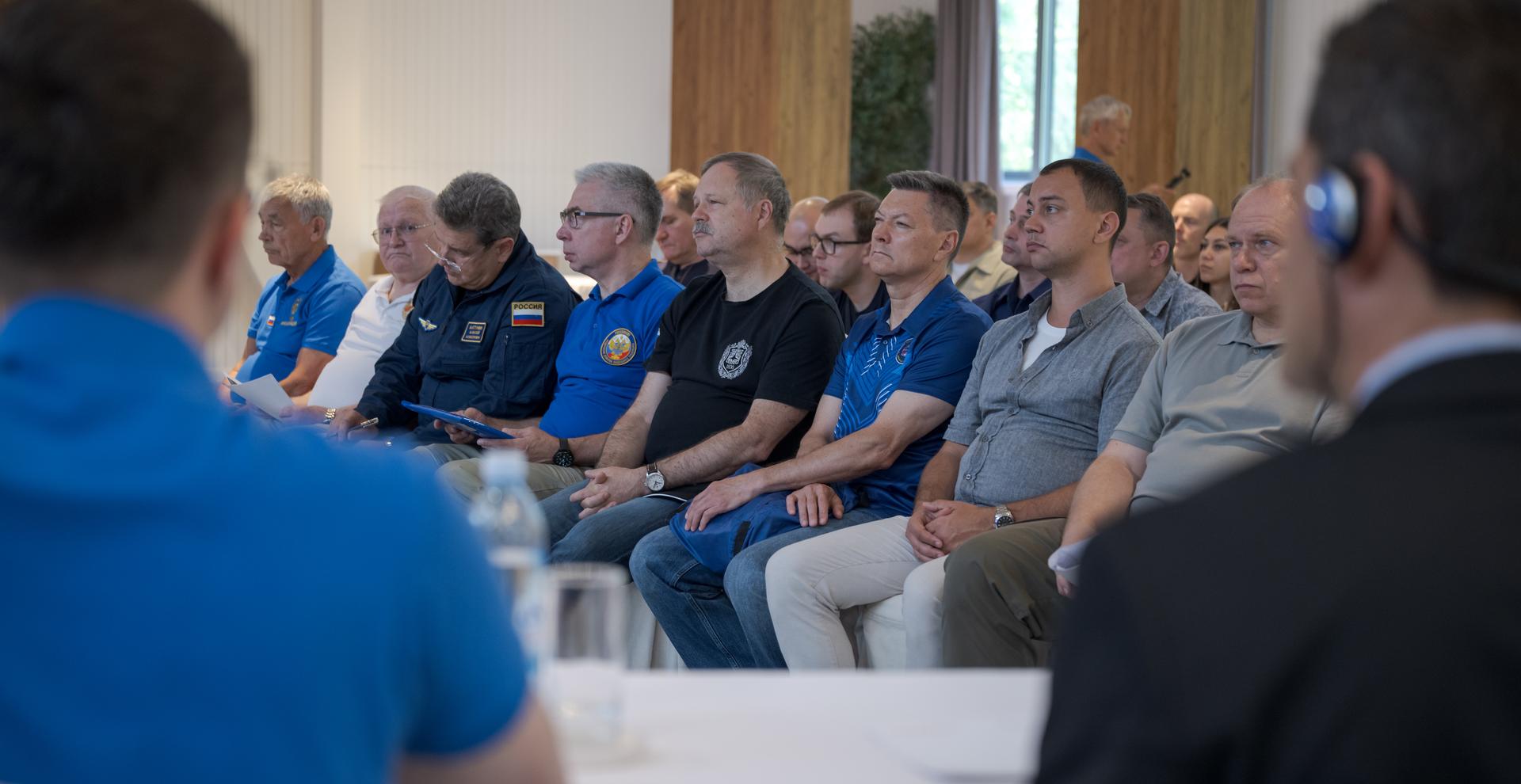 NASA, Roscosmos, and Russian Search and Recovery Forces meet at the Cosmonaut Hotel in Karaganda, Kazakhstan, Saturday, July 25, 2026, to discuss the readiness for the landing of Expedition 74 NASA astronaut Chris Williams, and Roscosmos cosmonauts Sergey Kud-Sverchkov, and Sergei Mikaev. Photo Credit: (NASA/Bill Ingalls)