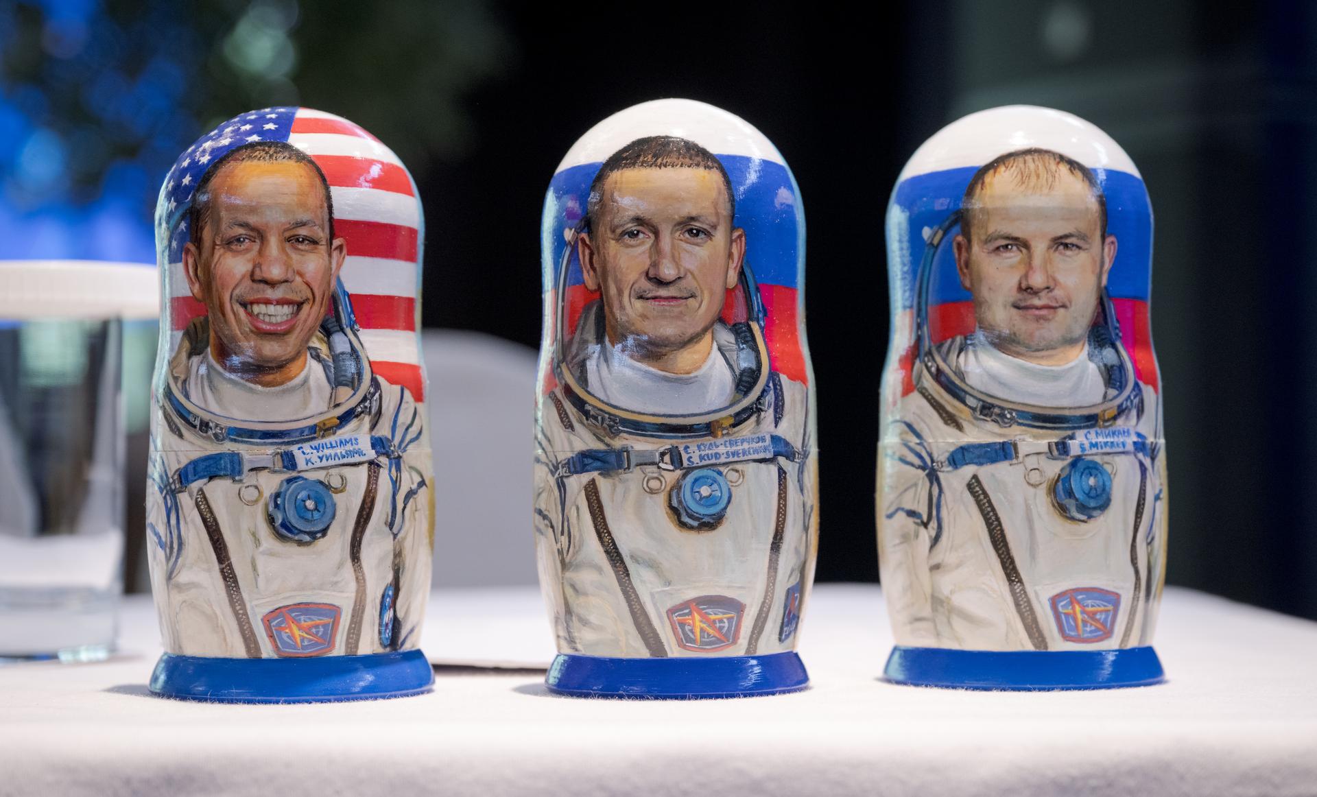 Matryoshka Dolls depicting Expedition 74 NASA astronaut Chris Williams, left, and Roscosmos cosmonauts Sergey Kud-Sverchkov, and Sergei Mikaev, right, are seen as NASA, Roscosmos, and Russian Search and Recovery Forces meet at the Cosmonaut Hotel in Karaganda, Kazakhstan, Saturday, July 25, 2026, to discuss the readiness for the landing of the trio from the International Space Station. Photo Credit: (NASA/Bill Ingalls)