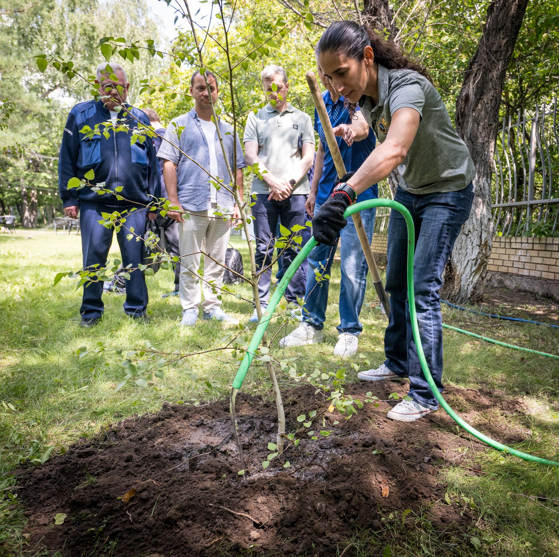 NASA astronaut and Astronaut Office representative Jasmin Moghbeli, plants a tree during a traditional ceremony at the Cosmonaut Hotel in Karaganda, Kazakhstan, Saturday, July 25. Moghbeli is in Karaganda to help support the Expedition 74 crew Soyuz landing from the International Space Station. Photo Credit: (NASA/Bill Ingalls)