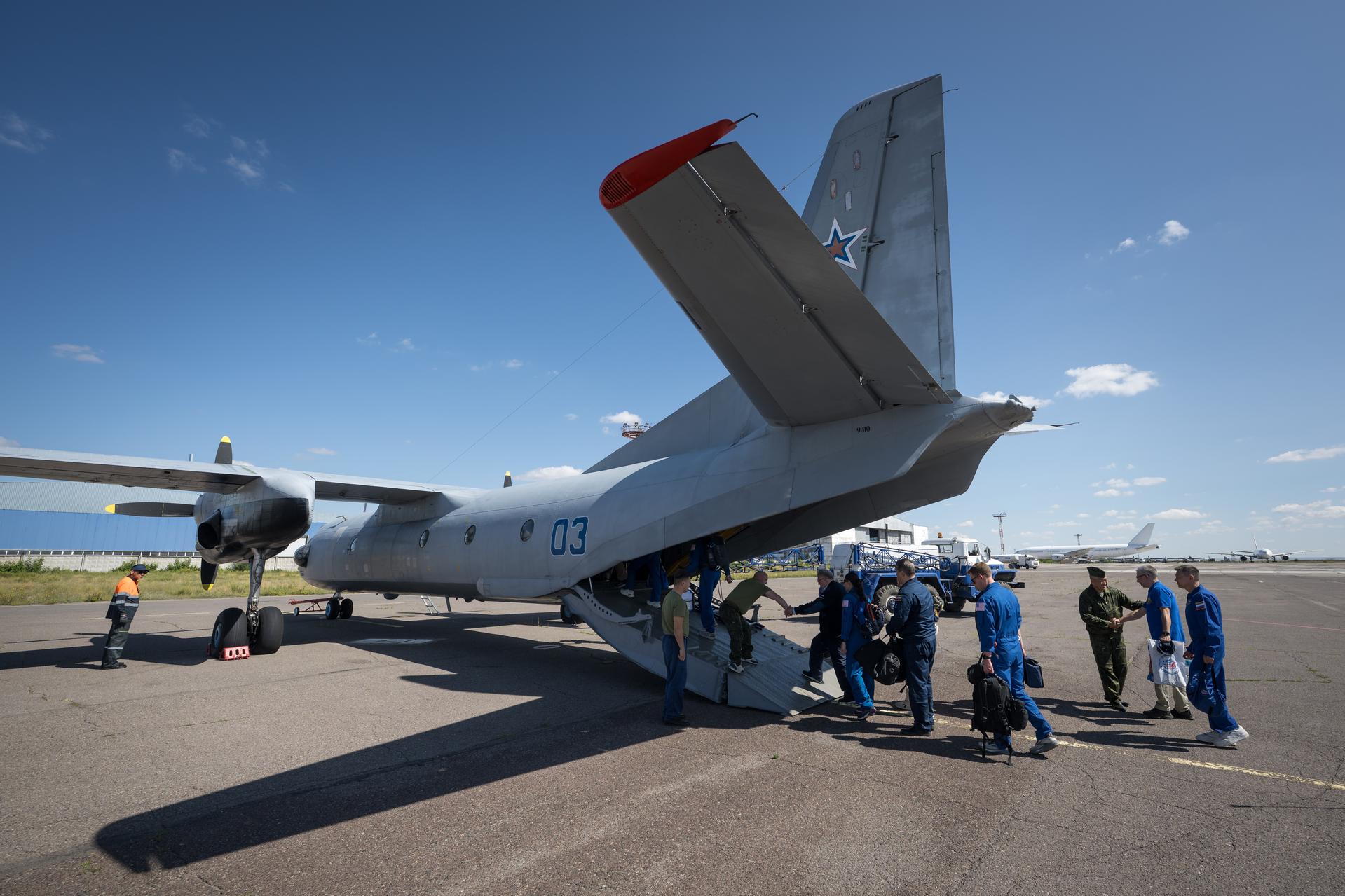 NASA, Roscosmos, and Russian Search and Recovery Forces board an AN-26 airplane in Karaganda to fly and stage in Zhezkazgan, Kazakhstan for the landing of Expedition 74 NASA astronaut Chris Williams, and Roscosmos cosmonauts Sergey Kud-Sverchkov, and Sergei Mikaev, Sunday, July 26, 2026. Williams, Kud-Sverchkov, and Mikaev, are returning to Earth after logging 241 days in space as a members of Expeditions 73 and 74 aboard the International Space Station. Photo Credit: (NASA/Bill Ingalls)