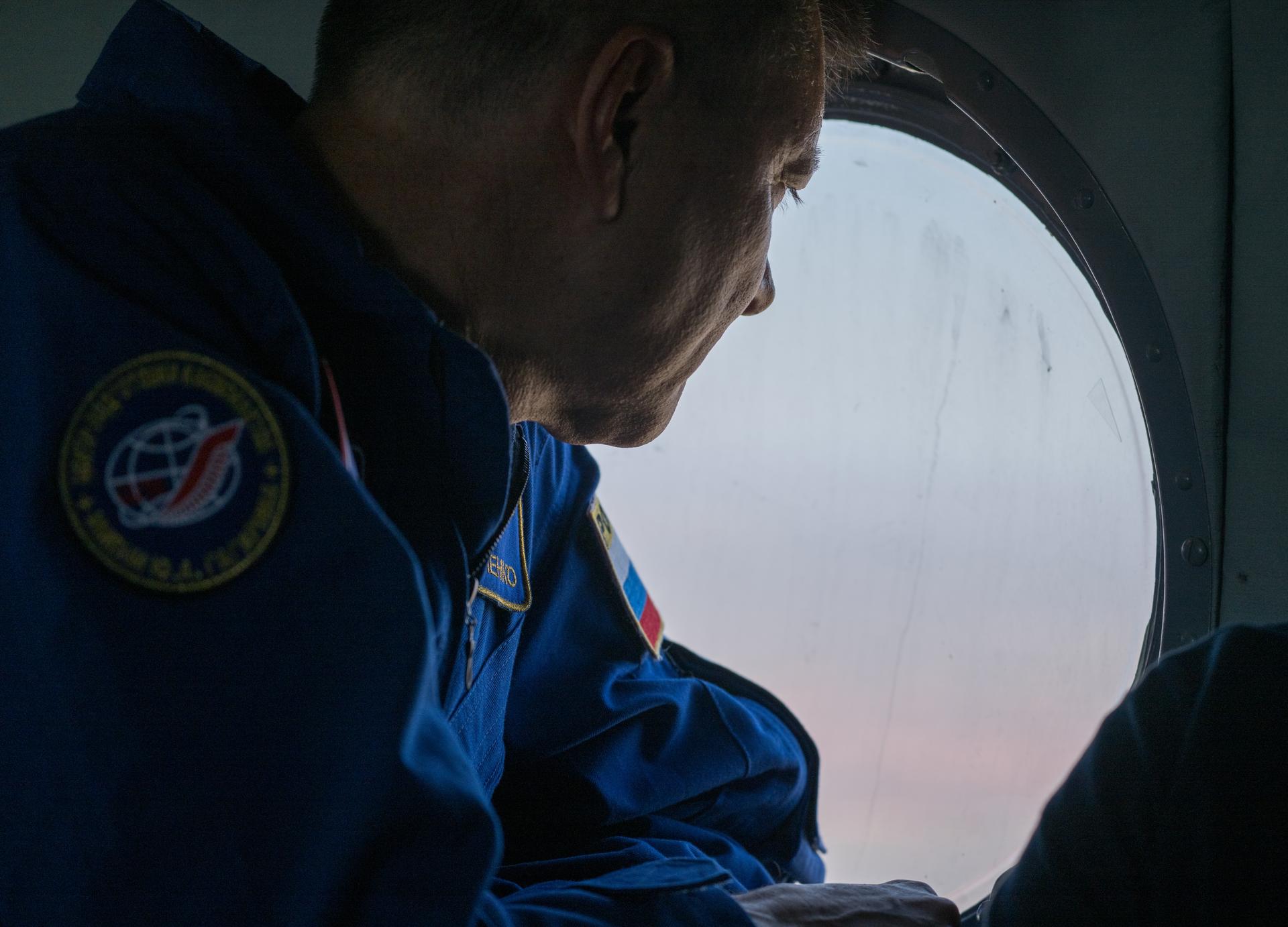 Head of Gargarin Cosmonaut Training Center Oleg Kononenko, looks out the window of a Russian MI-8 Helicopter as teams support the Soyuz MS-28 landing of Expedition 74 NASA astronaut Chris Williams, and Roscosmos cosmonauts Sergey Kud-Sverchkov, and Sergei Mikaev, Sunday, July 26, 2026 outside of Zhezkazgan, Kazakhstan. Williams, Kud-Sverchkov, and Mikaev, are returning to Earth after logging 241 days in space as a members of Expeditions 73 and 74 aboard the International Space Station. Photo Credit: (NASA/Bill Ingalls)