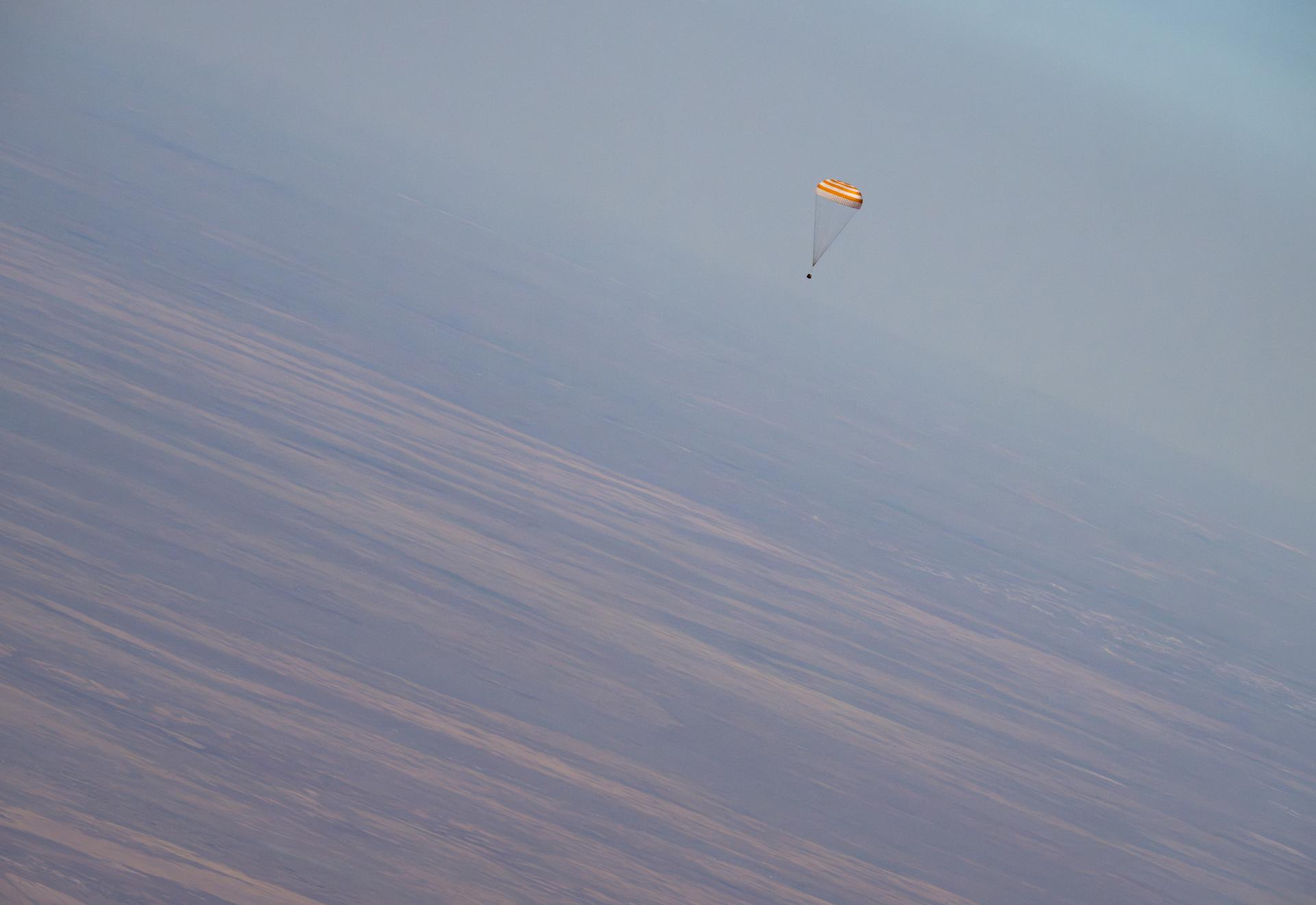 The Soyuz MS-28 spacecraft is seen as it lands in a remote area near the town of Zhezkazgan, Kazakhstan with Expedition 74 NASA astronaut Chris Williams, and Roscosmos cosmonauts Sergey Kud-Sverchkov, and Sergei Mikaev aboard, Sunday, July 26, 2026. The trio are returning to Earth after logging 241 days in space as members of Expeditions 73 and 74 aboard the International Space Station. Photo Credit: (NASA/Bill Ingalls)