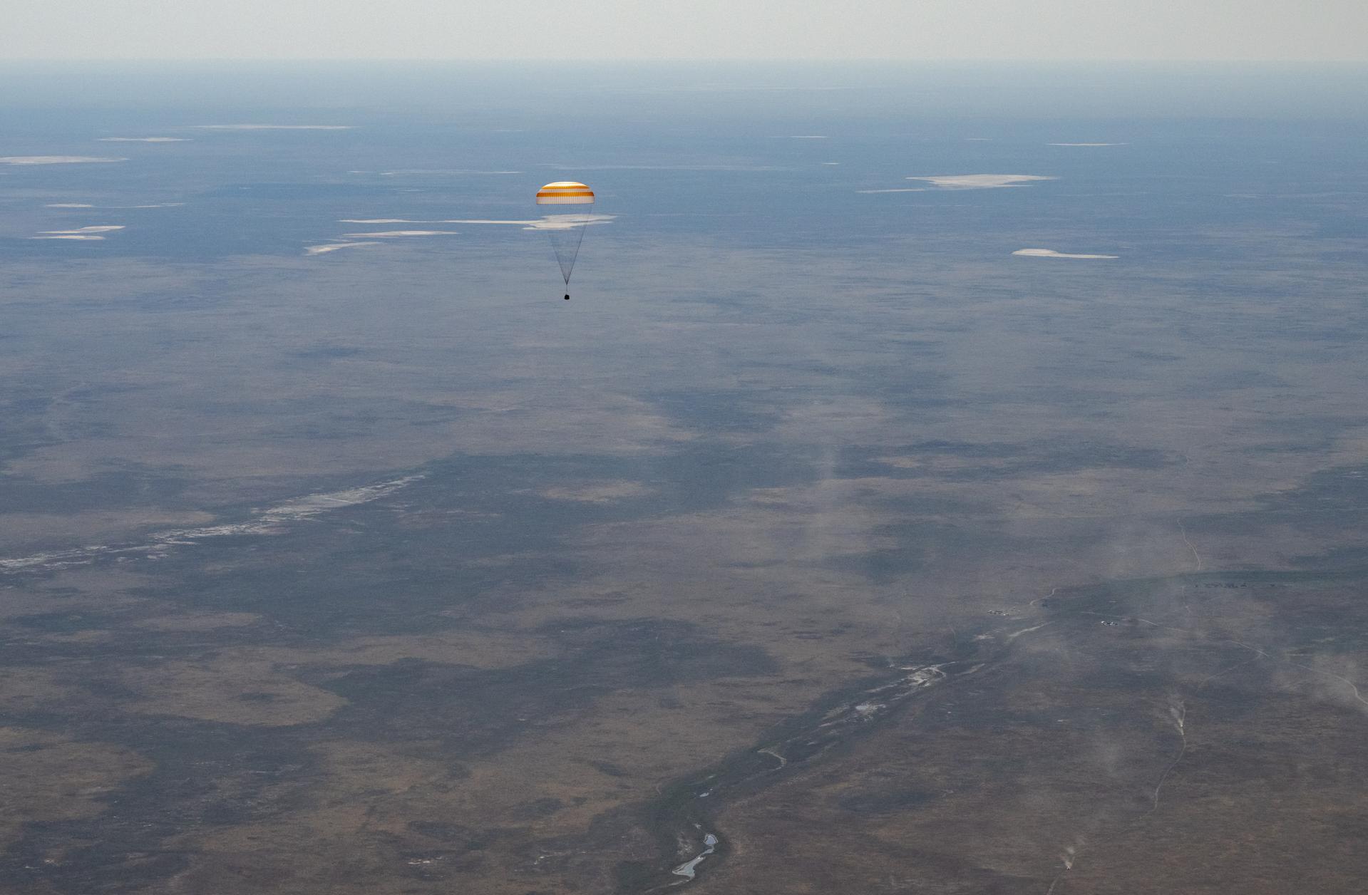 The Soyuz MS-28 spacecraft is seen as it lands in a remote area near the town of Zhezkazgan, Kazakhstan with Expedition 74 NASA astronaut Chris Williams, and Roscosmos cosmonauts Sergey Kud-Sverchkov, and Sergei Mikaev aboard, Sunday, July 26, 2026. The trio are returning to Earth after logging 241 days in space as members of Expeditions 73 and 74 aboard the International Space Station. Photo Credit: (NASA/Bill Ingalls)