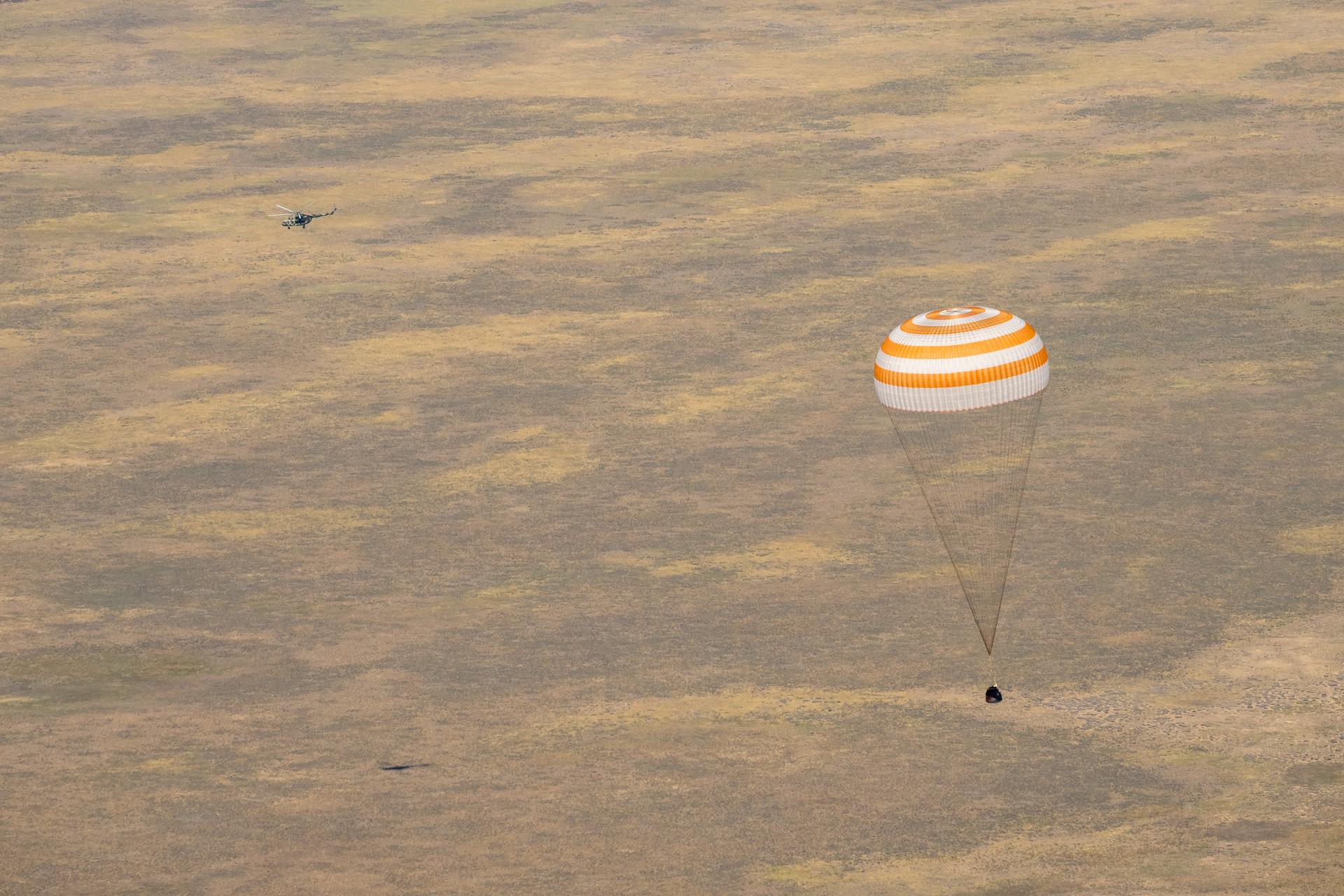 The Soyuz MS-28 spacecraft is seen as it lands in a remote area near the town of Zhezkazgan, Kazakhstan with Expedition 74 NASA astronaut Chris Williams, and Roscosmos cosmonauts Sergey Kud-Sverchkov, and Sergei Mikaev aboard, Sunday, July 26, 2026. The trio are returning to Earth after logging 241 days in space as members of Expeditions 73 and 74 aboard the International Space Station. Photo Credit: (NASA/Bill Ingalls)