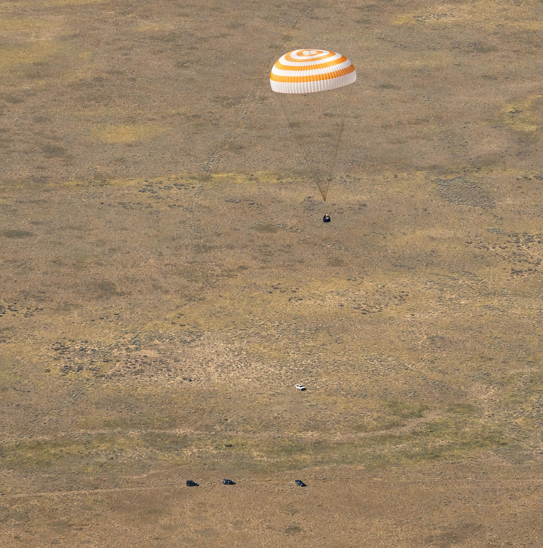 The Soyuz MS-28 spacecraft is seen as it lands in a remote area near the town of Zhezkazgan, Kazakhstan with Expedition 74 NASA astronaut Chris Williams, and Roscosmos cosmonauts Sergey Kud-Sverchkov, and Sergei Mikaev aboard, Sunday, July 26, 2026. The trio are returning to Earth after logging 241 days in space as members of Expeditions 73 and 74 aboard the International Space Station. Photo Credit: (NASA/Bill Ingalls)