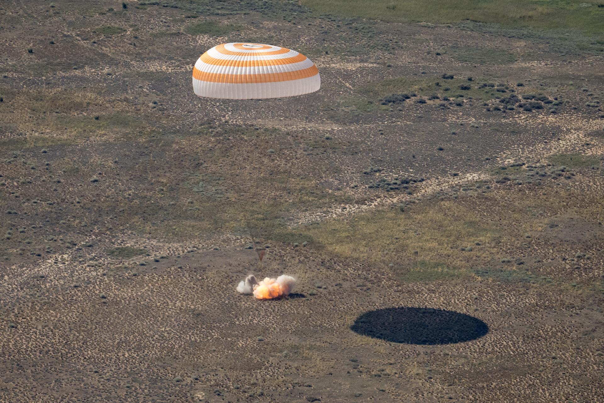 The Soyuz MS-28 spacecraft is seen as it lands in a remote area near the town of Zhezkazgan, Kazakhstan with Expedition 74 NASA astronaut Chris Williams, and Roscosmos cosmonauts Sergey Kud-Sverchkov, and Sergei Mikaev aboard, Sunday, July 26, 2026. The trio are returning to Earth after logging 241 days in space as members of Expeditions 73 and 74 aboard the International Space Station. Photo Credit: (NASA/Bill Ingalls)