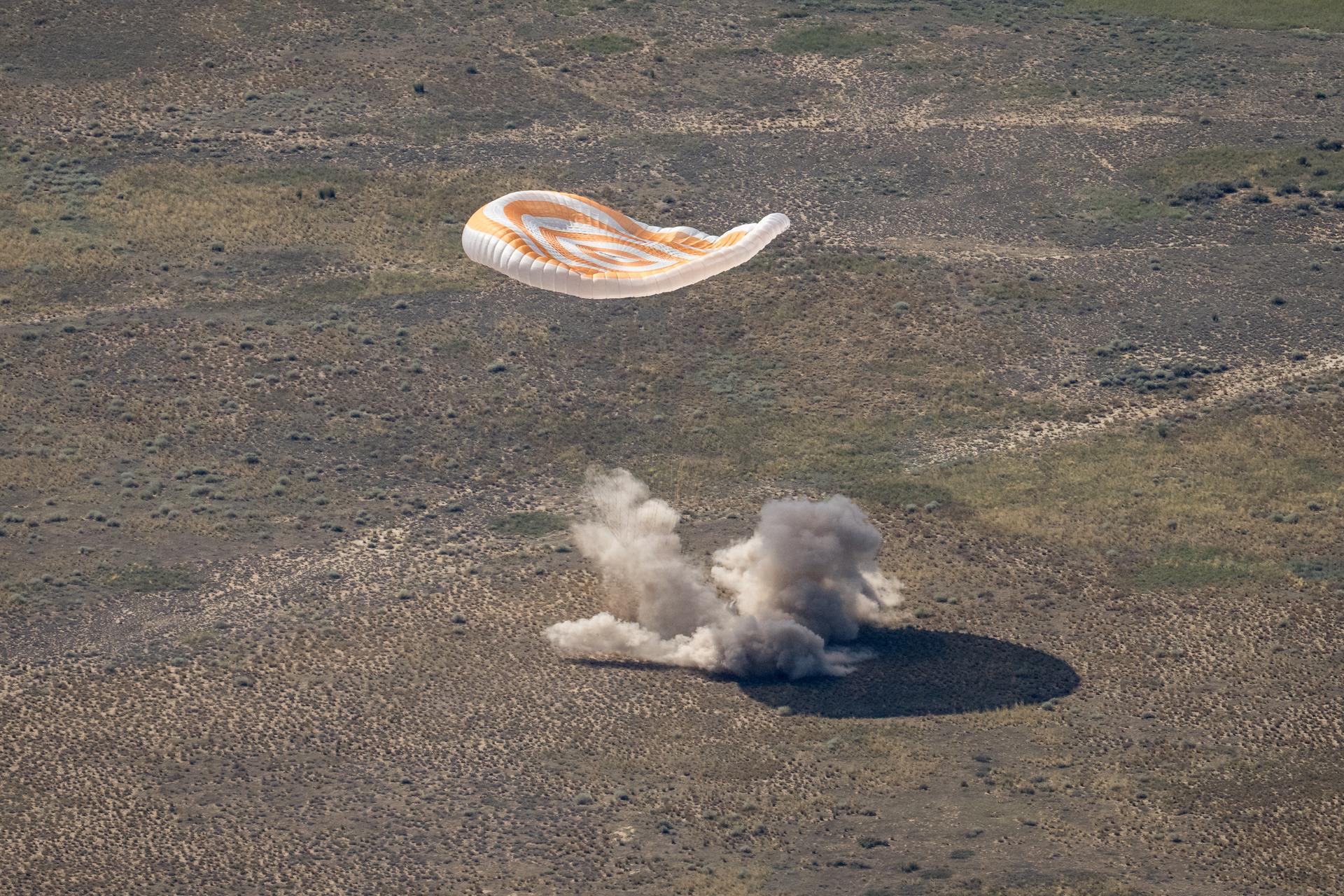 The Soyuz MS-28 spacecraft is seen as it lands in a remote area near the town of Zhezkazgan, Kazakhstan with Expedition 74 NASA astronaut Chris Williams, and Roscosmos cosmonauts Sergey Kud-Sverchkov, and Sergei Mikaev aboard, Sunday, July 26, 2026. The trio are returning to Earth after logging 241 days in space as members of Expeditions 73 and 74 aboard the International Space Station. Photo Credit: (NASA/Bill Ingalls)