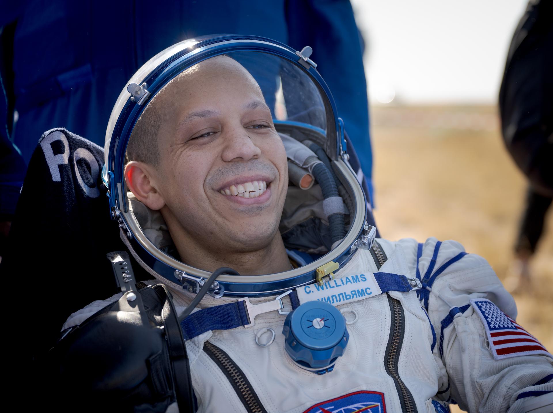 NASA astronaut Chris Williams is seen outside the Soyuz MS-28 spacecraft after he landed with Expedition 74 Roscosmos cosmonauts Sergey Kud-Sverchkov, and Sergei Mikaev in a remote area near the town of Zhezkazgan, Kazakhstan on Sunday, July 26, 2026. The trio returned to Earth after logging 241 days in space as a members of Expeditions 73 and 74 aboard the International Space Station. Photo Credit: (NASA/Bill Ingalls)