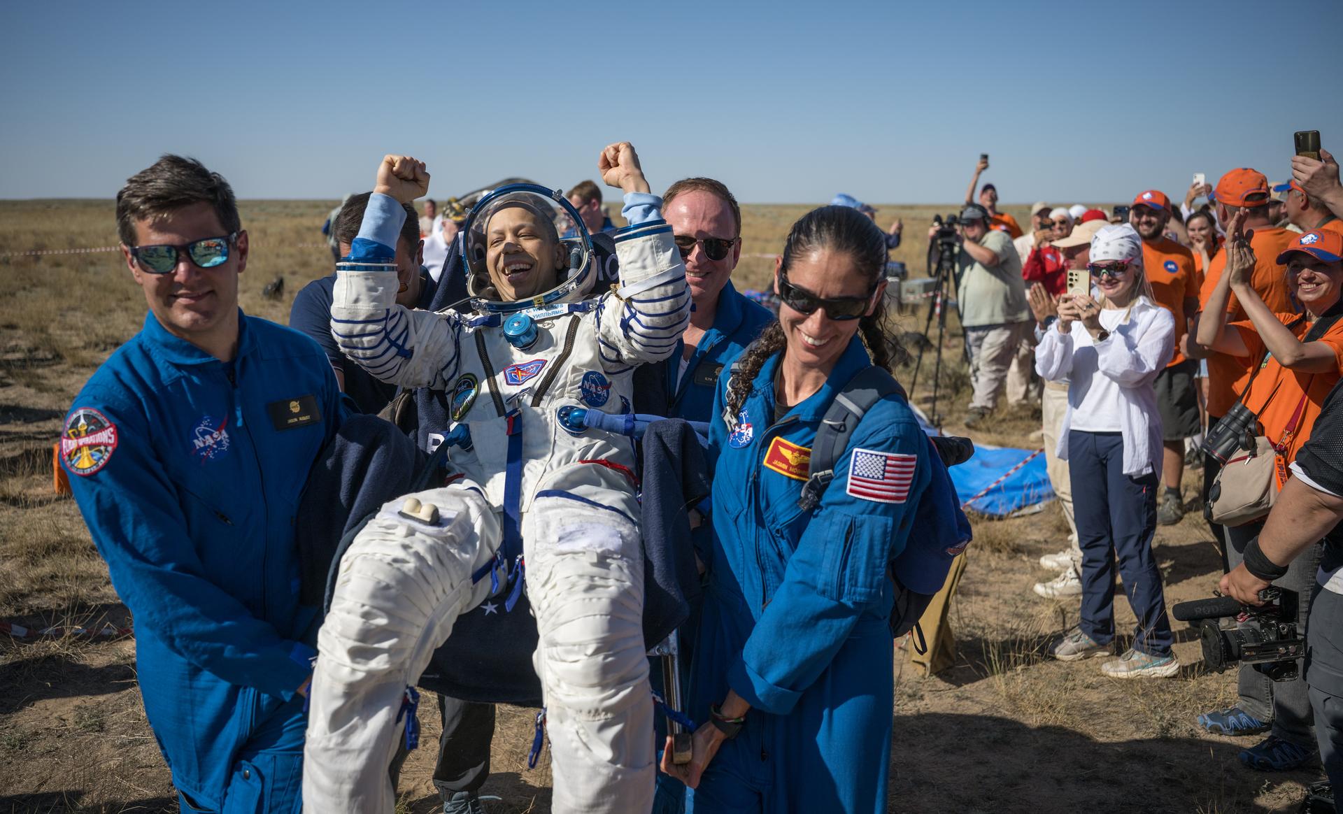 NASA astronaut Chris Williams is carried to a medical tent shortly after he and Roscosmos cosmonauts Sergey Kud-Sverchkov, and Sergei Mikaev landed in their Soyuz MS-28 spacecraft near the town of Zhezkazgan, Kazakhstan on Sunday, July 26, 2026. The trio returned to Earth after logging 241 days in space as a members of Expeditions 73 and 74 aboard the International Space Station. Photo Credit: (NASA/Bill Ingalls)