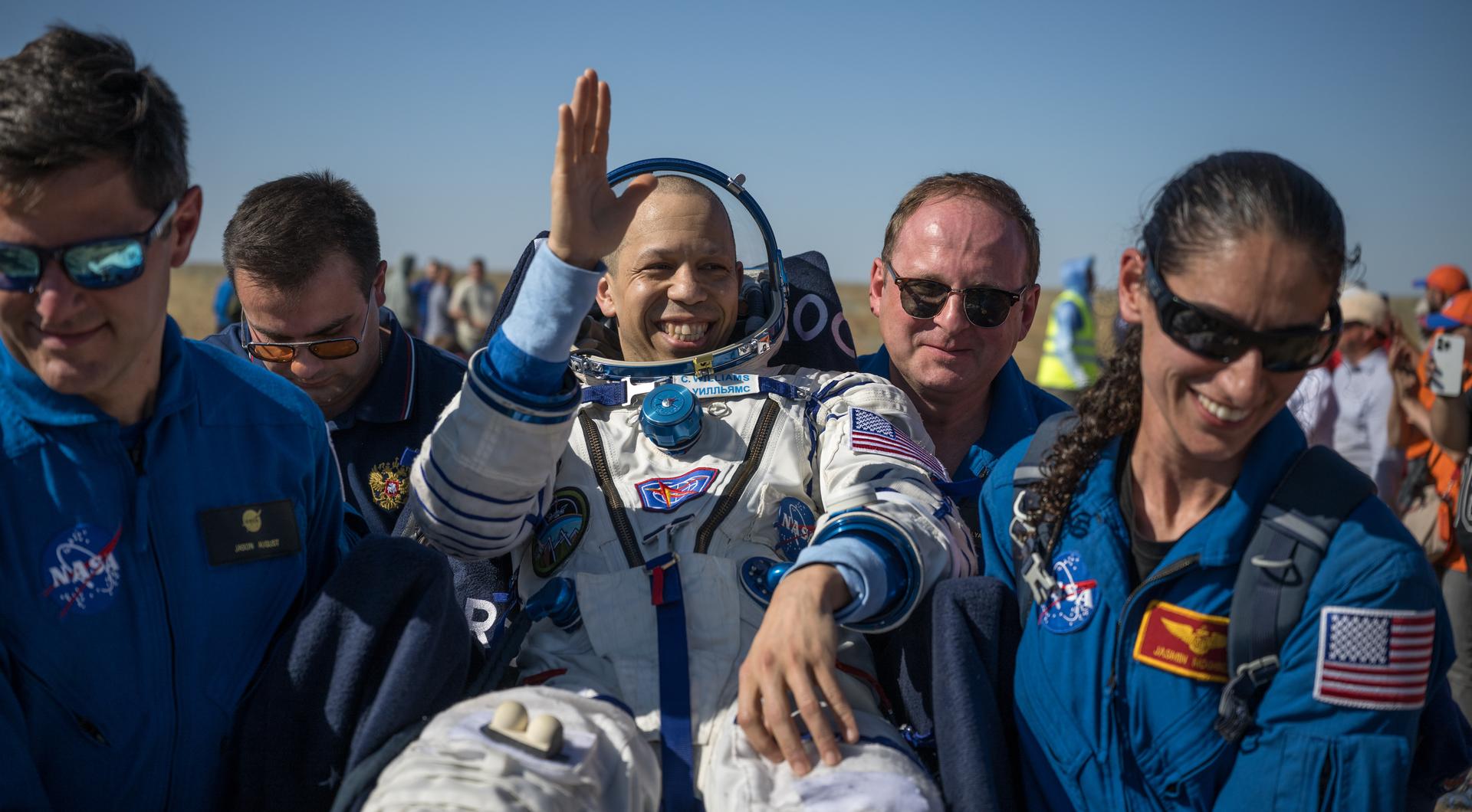 NASA astronaut Chris Williams is carried to a medical tent shortly after he and Roscosmos cosmonauts Sergey Kud-Sverchkov, and Sergei Mikaev landed in their Soyuz MS-28 spacecraft near the town of Zhezkazgan, Kazakhstan on Sunday, July 26, 2026. The trio returned to Earth after logging 241 days in space as a members of Expeditions 73 and 74 aboard the International Space Station. Photo Credit: (NASA/Bill Ingalls)