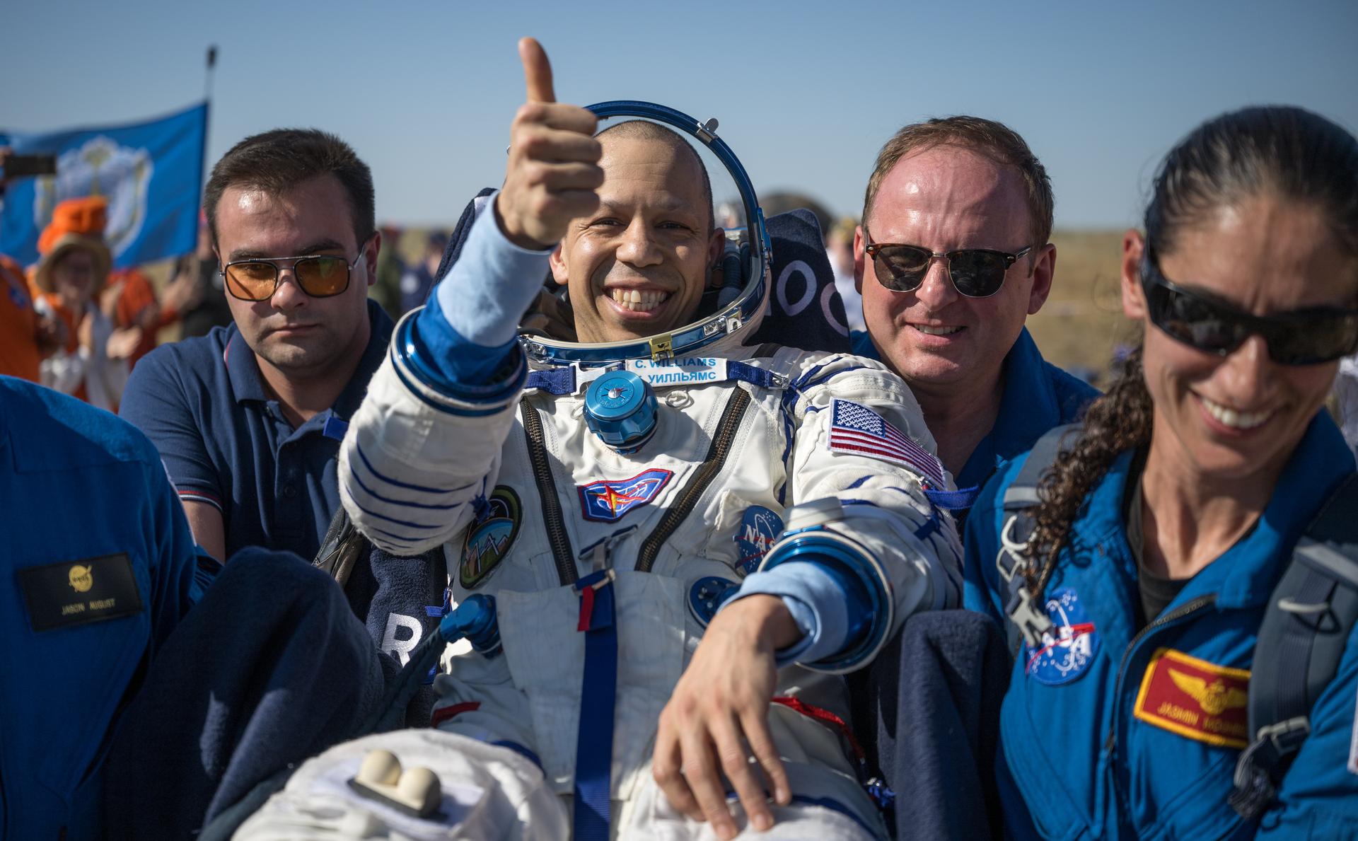 NASA astronaut Chris Williams is carried to a medical tent shortly after he and Roscosmos cosmonauts Sergey Kud-Sverchkov, and Sergei Mikaev landed in their Soyuz MS-28 spacecraft near the town of Zhezkazgan, Kazakhstan on Sunday, July 26, 2026. The trio returned to Earth after logging 241 days in space as a members of Expeditions 73 and 74 aboard the International Space Station. Photo Credit: (NASA/Bill Ingalls)