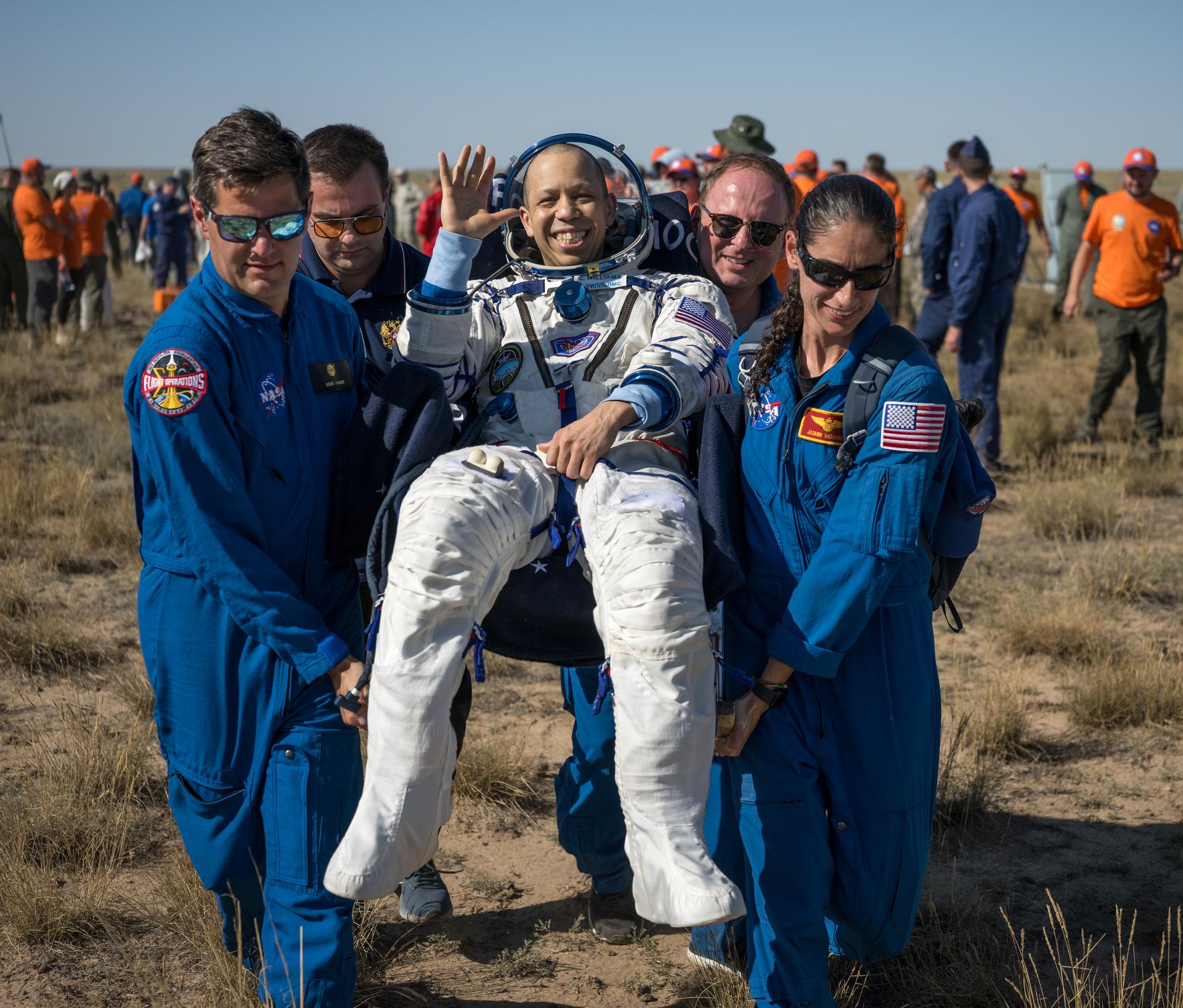 NASA astronaut Chris Williams is carried to a medical tent shortly after he and Roscosmos cosmonauts Sergey Kud-Sverchkov, and Sergei Mikaev landed in their Soyuz MS-28 spacecraft near the town of Zhezkazgan, Kazakhstan on Sunday, July 26, 2026. The trio returned to Earth after logging 241 days in space as a members of Expeditions 73 and 74 aboard the International Space Station. Photo Credit: (NASA/Bill Ingalls)