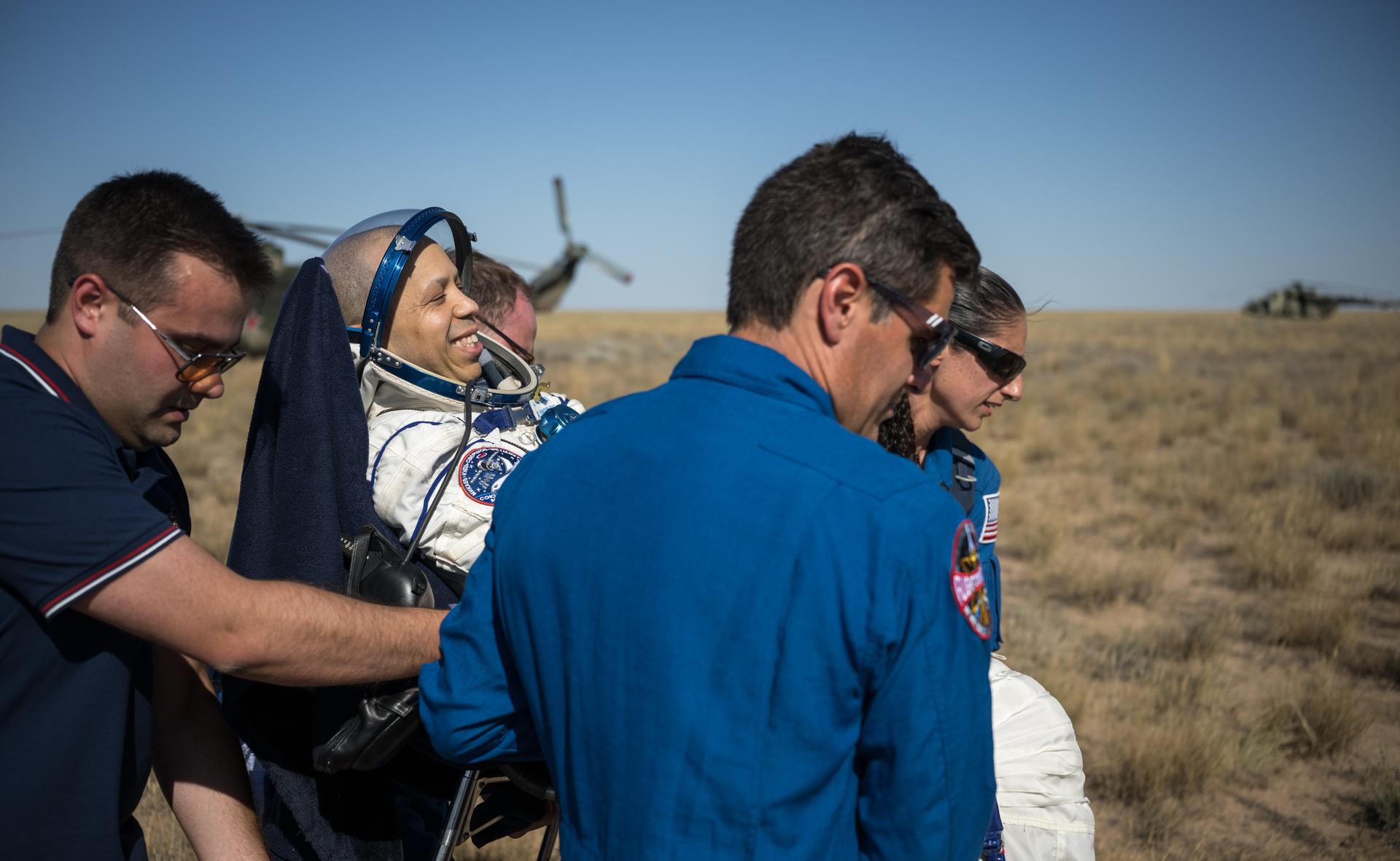 NASA astronaut Chris Williams is carried to a medical tent shortly after he and Roscosmos cosmonauts Sergey Kud-Sverchkov, and Sergei Mikaev landed in their Soyuz MS-28 spacecraft near the town of Zhezkazgan, Kazakhstan on Sunday, July 26, 2026. The trio returned to Earth after logging 241 days in space as a members of Expeditions 73 and 74 aboard the International Space Station. Photo Credit: (NASA/Bill Ingalls)