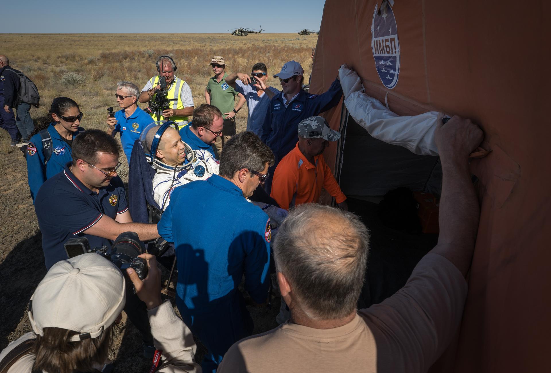 NASA astronaut Chris Williams is carried to a medical tent shortly after he and Roscosmos cosmonauts Sergey Kud-Sverchkov, and Sergei Mikaev landed in their Soyuz MS-28 spacecraft near the town of Zhezkazgan, Kazakhstan on Sunday, July 26, 2026. The trio returned to Earth after logging 241 days in space as a members of Expeditions 73 and 74 aboard the International Space Station. Photo Credit: (NASA/Bill Ingalls)