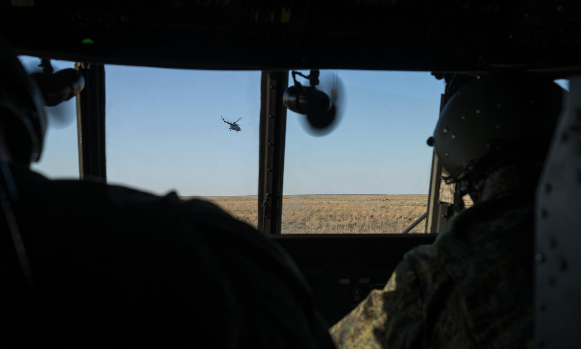 Helicopters depart the Soyuz MS-28 spacecraft landing site in a remote area near the town of Zhezkazgan, Kazakhstan after the landing of Expedition 74 NASA astronaut Chris Williams, and Roscosmos cosmonauts Sergey Kud-Sverchkov, and Sergei Mikaev, Sunday, July 26, 2026. The trio returned to Earth after logging 241 days in space as members of Expeditions 73 and 74 aboard the International Space Station. Photo Credit: (NASA/Bill Ingalls)