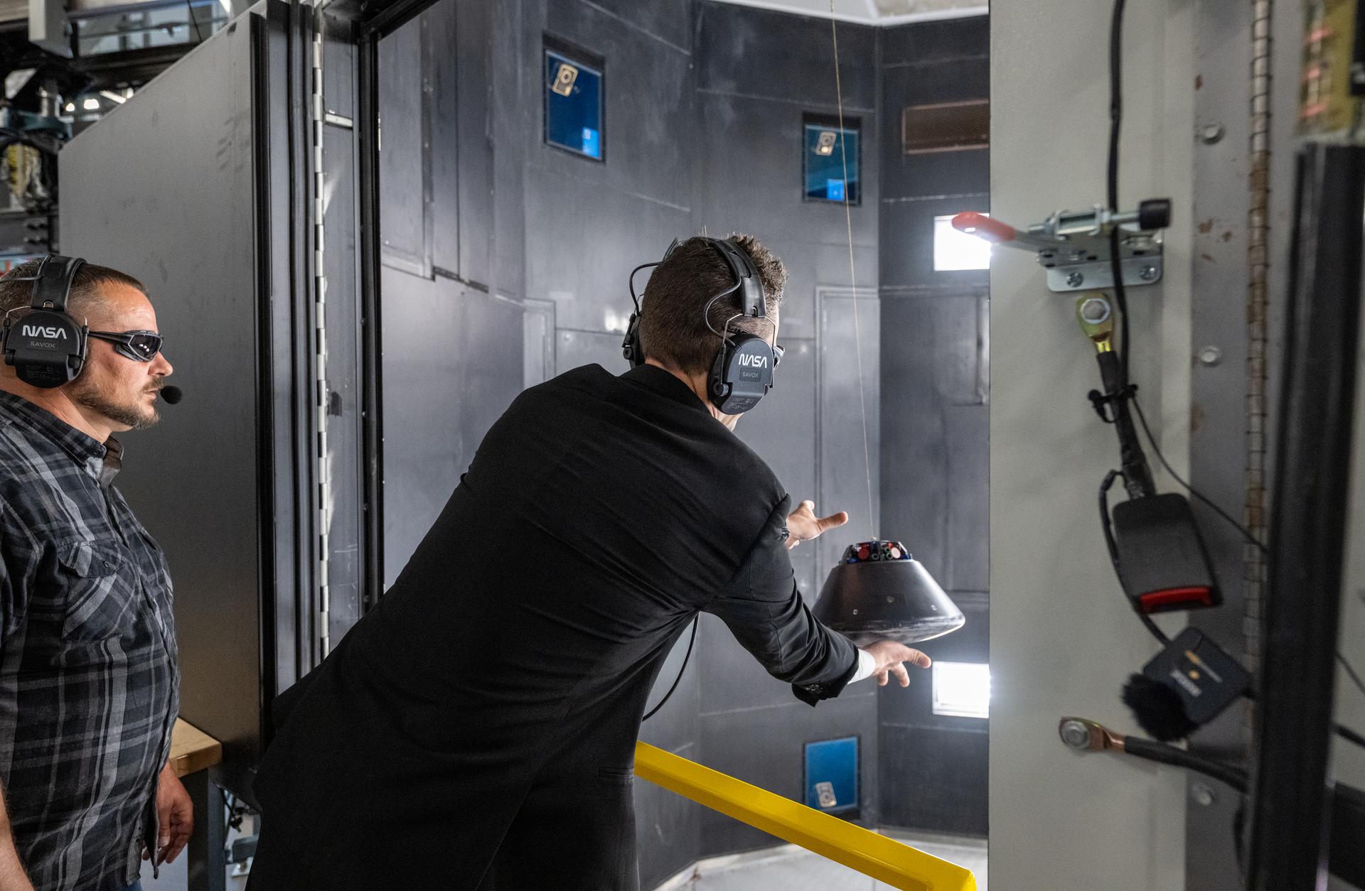NASA Administrator Jared Isaacman launches a scale model of the Orion capsule during a demonstration at the Flight Dynamics Research Facility, NASA's newest wind tunnel, Friday, July 31, 2026, at NASA’s Langley Research Center in Hampton, Virginia. The state-of-the-art facility will support research and technology development that will advance the agency’s aeronautics, exploration, and science goals, including establishing a sustained human presence on the lunar surface through the Artemis program and the development of a Moon Base. Photo Credit: (NASA/Keegan Barber)