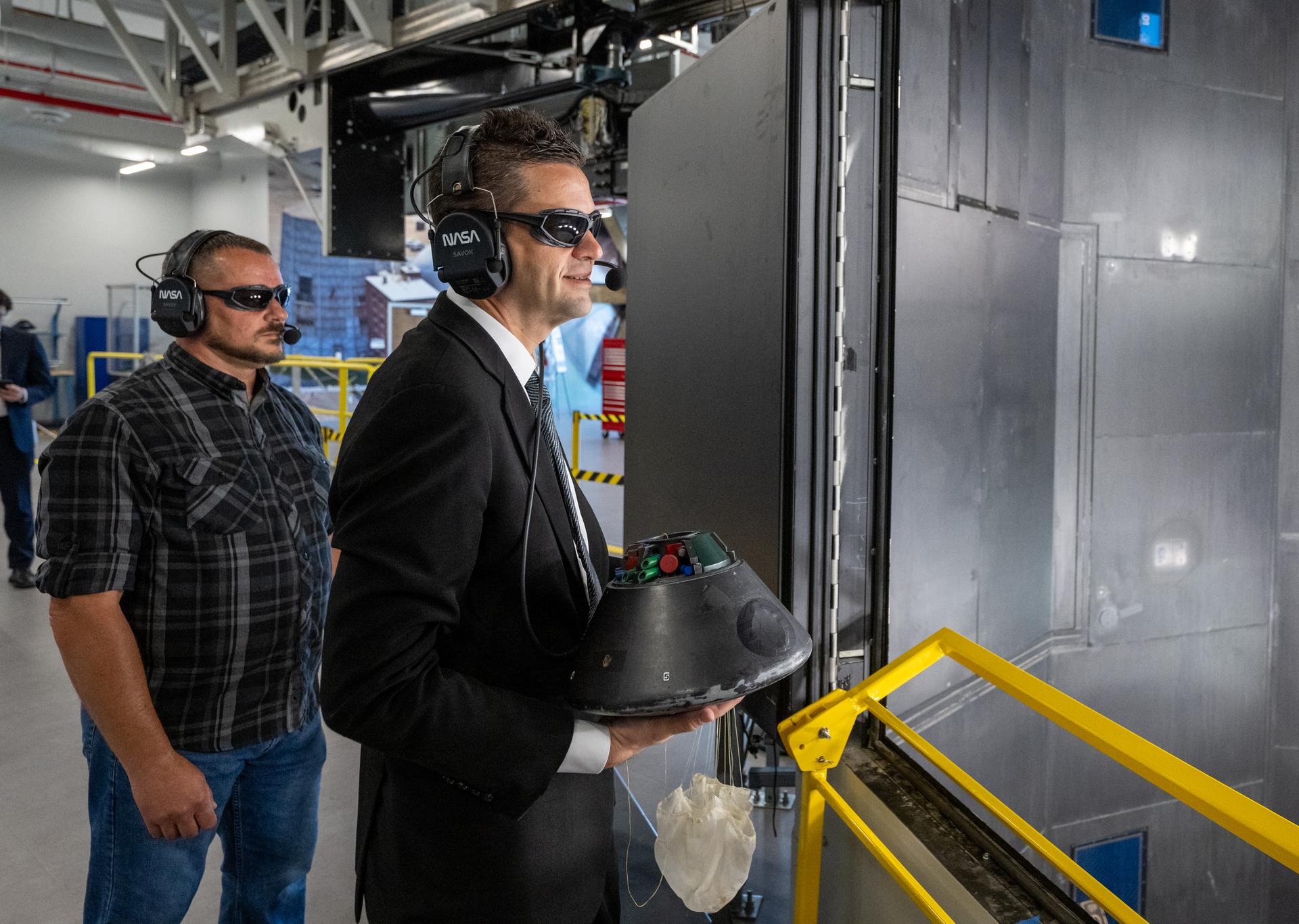 NASA Administrator Jared Isaacman prepares to launch a scale model of the Orion capsule for a demonstration at the Flight Dynamics Research Facility, NASA's newest wind tunnel, Friday, July 31, 2026, at NASA’s Langley Research Center in Hampton, Virginia. The state-of-the-art facility will support research and technology development that will advance the agency’s aeronautics, exploration, and science goals, including establishing a sustained human presence on the lunar surface through the Artemis program and the development of a Moon Base. Photo Credit: (NASA/Keegan Barber)