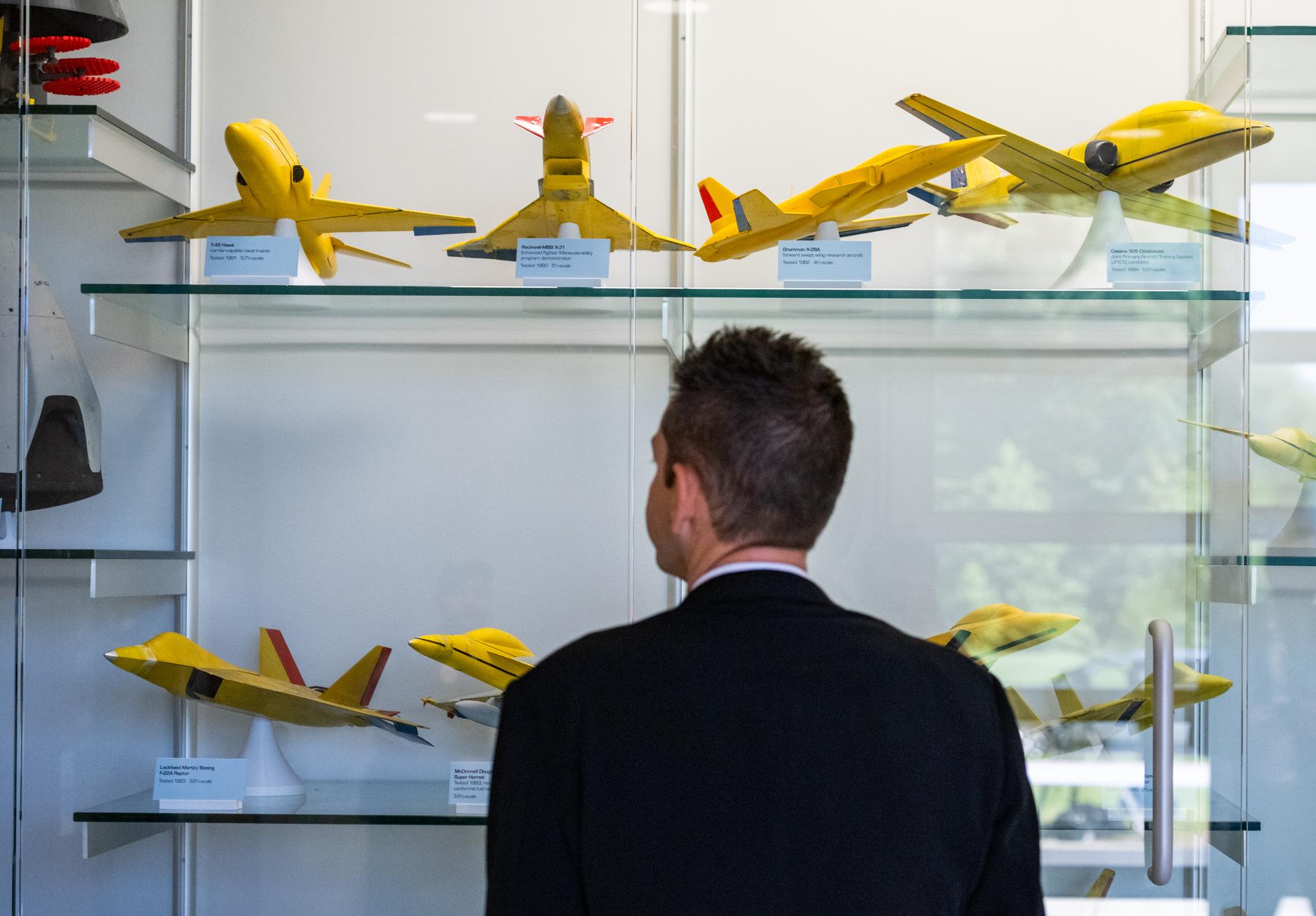 NASA Administrator Jared Isaacman views scale models of aircraft during a tour of the Flight Dynamics Research Facility, NASA's newest wind tunnel, Friday, July 31, 2026, at NASA’s Langley Research Center in Hampton, Virginia. The state-of-the-art facility will support research and technology development that will advance the agency’s aeronautics, exploration, and science goals, including establishing a sustained human presence on the lunar surface through the Artemis program and the development of a Moon Base. Photo Credit: (NASA/Keegan Barber)