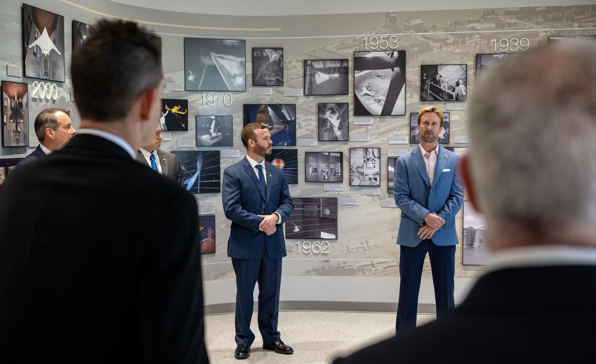 Corey Diebler, facility manager, right, and Ryan Smith, project manager, left, speak with NASA Administrator Jared Isaacman and Edward C. Forst, Administrator of the General Services Administration during a tour of the Flight Dynamics Research Facility, NASA's newest wind tunnel, Friday, July 31, 2026, at NASA’s Langley Research Center in Hampton, Virginia. The state-of-the-art facility will support research and technology development that will advance the agency’s aeronautics, exploration, and science goals, including establishing a sustained human presence on the lunar surface through the Artemis program and the development of a Moon Base. Photo Credit: (NASA/Keegan Barber)