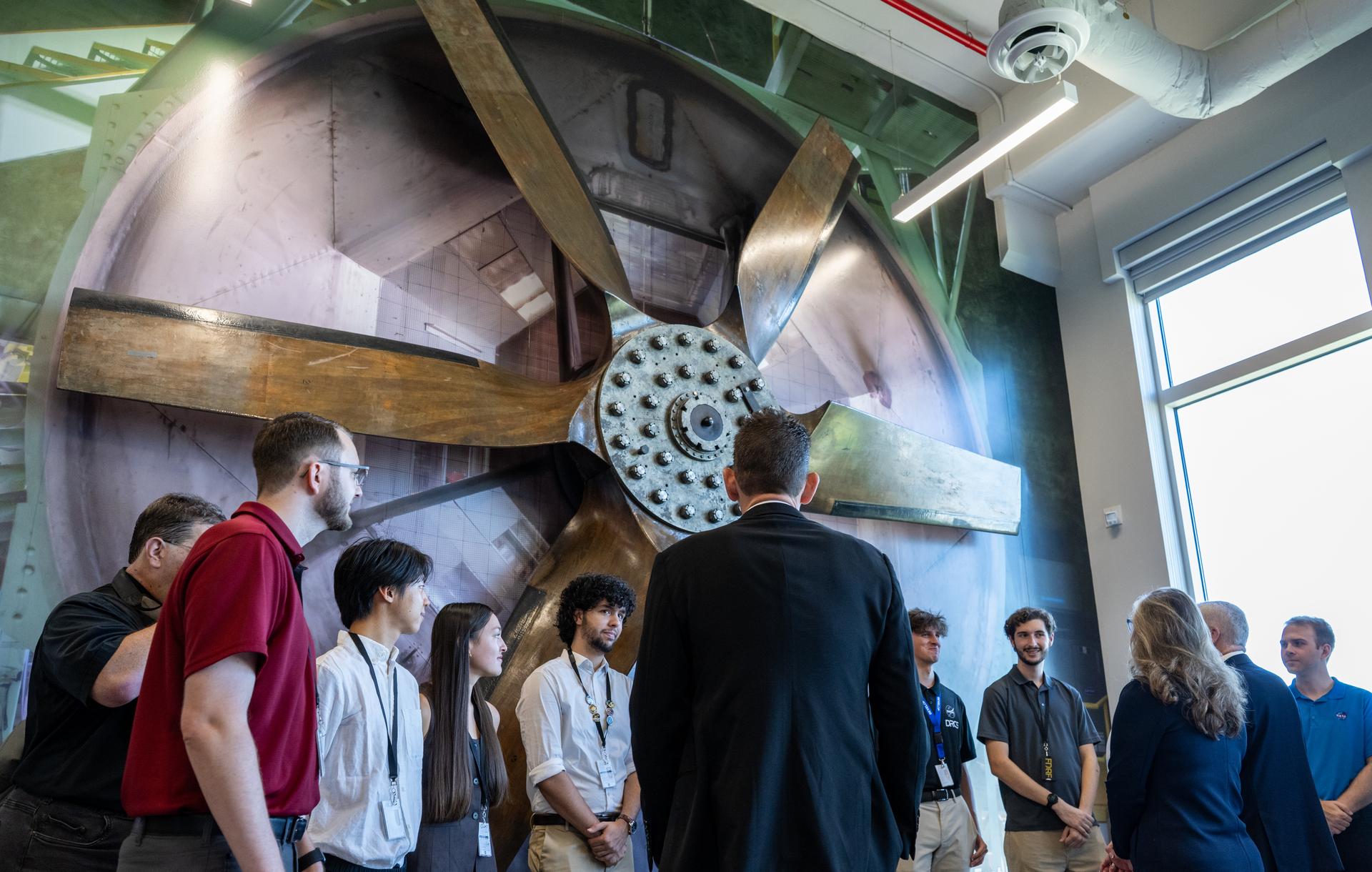 NASA Administrator Jared Isaacman, center, meets with interns during a tour of the Flight Dynamics Research Facility, NASA's newest wind tunnel, Friday, July 31, 2026, at NASA’s Langley Research Center in Hampton, Virginia. The state-of-the-art facility will support research and technology development that will advance the agency’s aeronautics, exploration, and science goals, including establishing a sustained human presence on the lunar surface through the Artemis program and the development of a Moon Base. Photo Credit: (NASA/Keegan Barber)