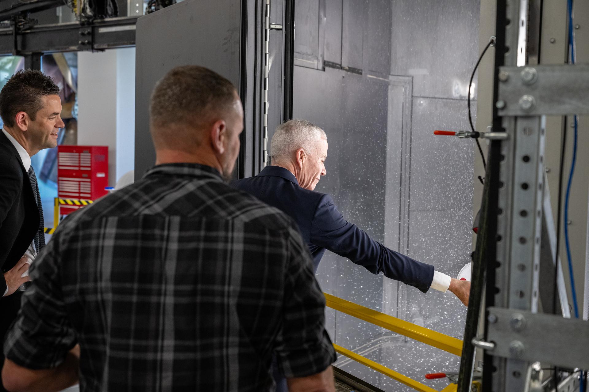 Edward C. Forst, Administrator of the General Services Administration, right, participates in a water test demonstration alongside NASA Administrator Jared Isaacman, left, and by Rick Thorpe, equipment specialist, center, at the Flight Dynamics Research Facility, NASA's newest wind tunnel, Friday, July 31, 2026, at NASA’s Langley Research Center in Hampton, Virginia. The state-of-the-art facility will support research and technology development that will advance the agency’s aeronautics, exploration, and science goals, including establishing a sustained human presence on the lunar surface through the Artemis program and the development of a Moon Base. Photo Credit: (NASA/Keegan Barber)