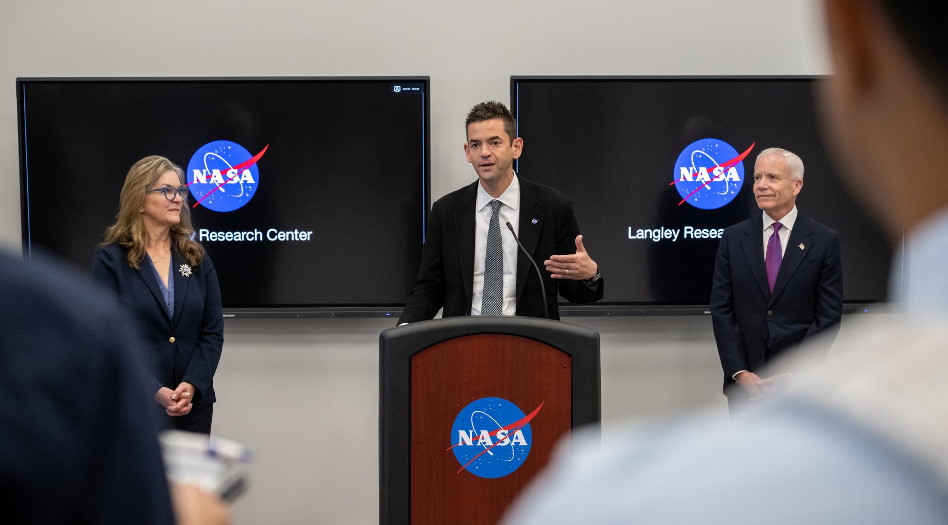 NASA Administrator Jared Isaacman speaks with members of the media alongside Dr. Trina Dyal, director of NASA's Langley Research Center, left, and Edward C. Forst, Administrator of the General Services Administration, right, at the Flight Dynamics Research Facility, NASA's newest wind tunnel, Friday, July 31, 2026, at NASA’s Langley Research Center in Hampton, Virginia. The state-of-the-art facility will support research and technology development that will advance the agency’s aeronautics, exploration, and science goals, including establishing a sustained human presence on the lunar surface through the Artemis program and the development of a Moon Base. Photo Credit: (NASA/Keegan Barber)