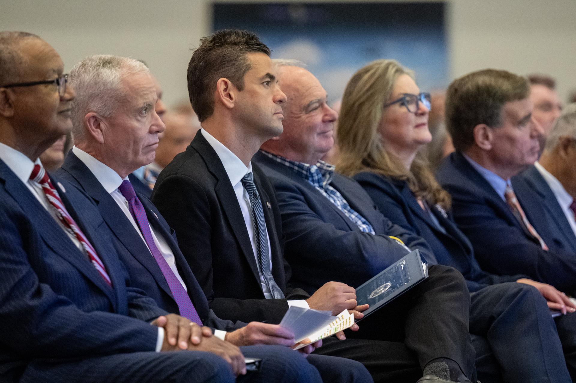 From left to right, City of Hampton Mayor Jimmy Gray, Edward C. Forst, Administrator of the General Services Administration, NASA Administrator Jared Isaacman, Senator Tim Kaine (D-Va.), Dr. Trina Dyal, director of NASA's Langley Research Center, and Senator Mark Warner (D-Va.) are seen during a ribbon cutting ceremony for the Flight Dynamics Research Facility, NASA's newest wind tunnel, Friday, July 31, 2026, at NASA’s Langley Research Center in Hampton, Virginia. The state-of-the-art facility will support research and technology development that will advance the agency’s aeronautics, exploration, and science goals, including establishing a sustained human presence on the lunar surface through the Artemis program and the development of a Moon Base. Photo Credit: (NASA/Keegan Barber)