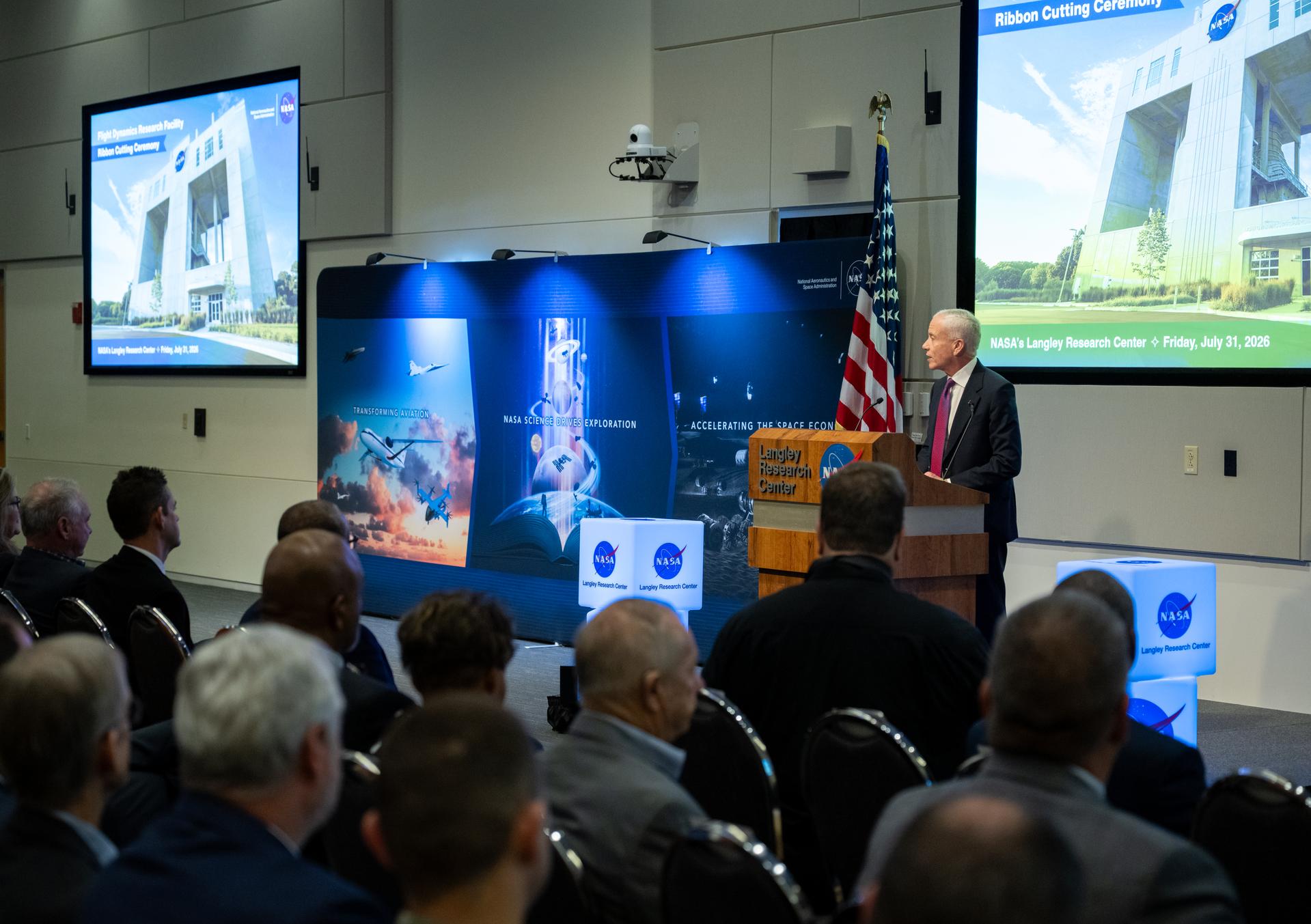 Edward C. Forst, Administrator of the General Services Administration delivers remarks during a ribbon cutting ceremony for the Flight Dynamics Research Facility, NASA's newest wind tunnel, Friday, July 31, 2026, at NASA’s Langley Research Center in Hampton, Virginia. The state-of-the-art facility will support research and technology development that will advance the agency’s aeronautics, exploration, and science goals, including establishing a sustained human presence on the lunar surface through the Artemis program and the development of a Moon Base. Photo Credit: (NASA/Keegan Barber)