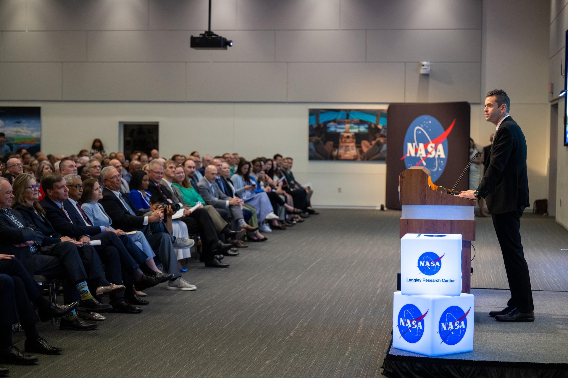 NASA Administrator Jared Isaacman delivers remarks during a ribbon cutting ceremony for the Flight Dynamics Research Facility, NASA's newest wind tunnel,  Friday, July 31, 2026, at NASA’s Langley Research Center in Hampton, Virginia. The state-of-the-art facility will support research and technology development that will advance the agency’s aeronautics, exploration, and science goals, including establishing a sustained human presence on the lunar surface through the Artemis program and the development of a Moon Base. Photo Credit: (NASA/Keegan Barber)
