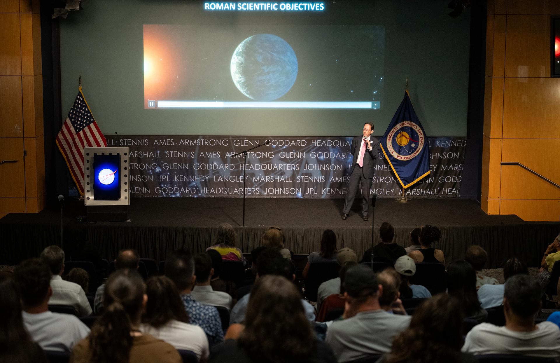 Dr. Dominic Benford, program scientist for the nancy grace roman space telescope, speaks at a Frontiers Forum event titled "Countdown to Launch – Why We’re Excited about the Nancy Grace Roman Space Telescope," Thursday, Aug. 6, 2026, at the Mary W. Jackson NASA Headquarters building in Washington.  Photo Credit: (NASA/Keegan Barber)